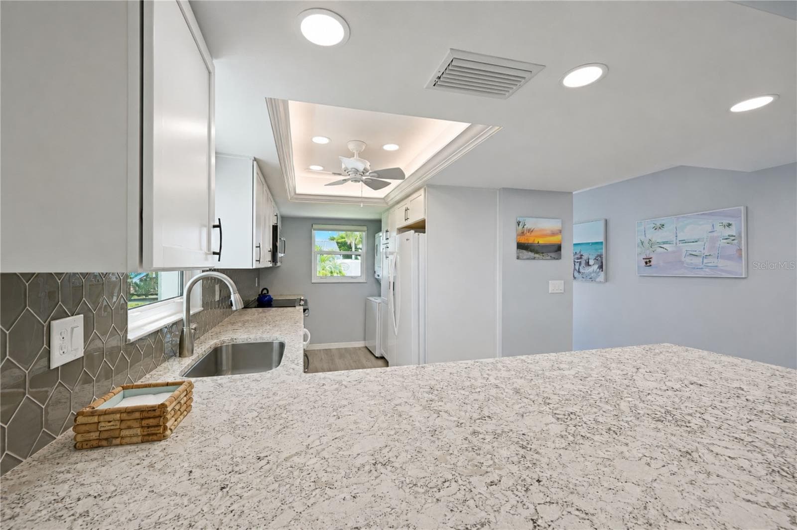 View of kitchen over breakfast bar - 9411 CONCORD CIR, BRADENTON