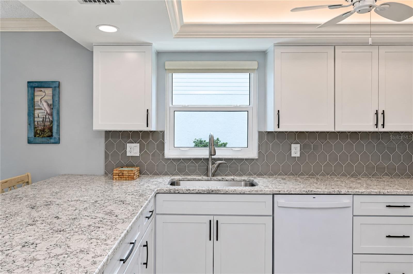 View of kitchen from hall - 9411 CONCORD CIR, BRADENTON