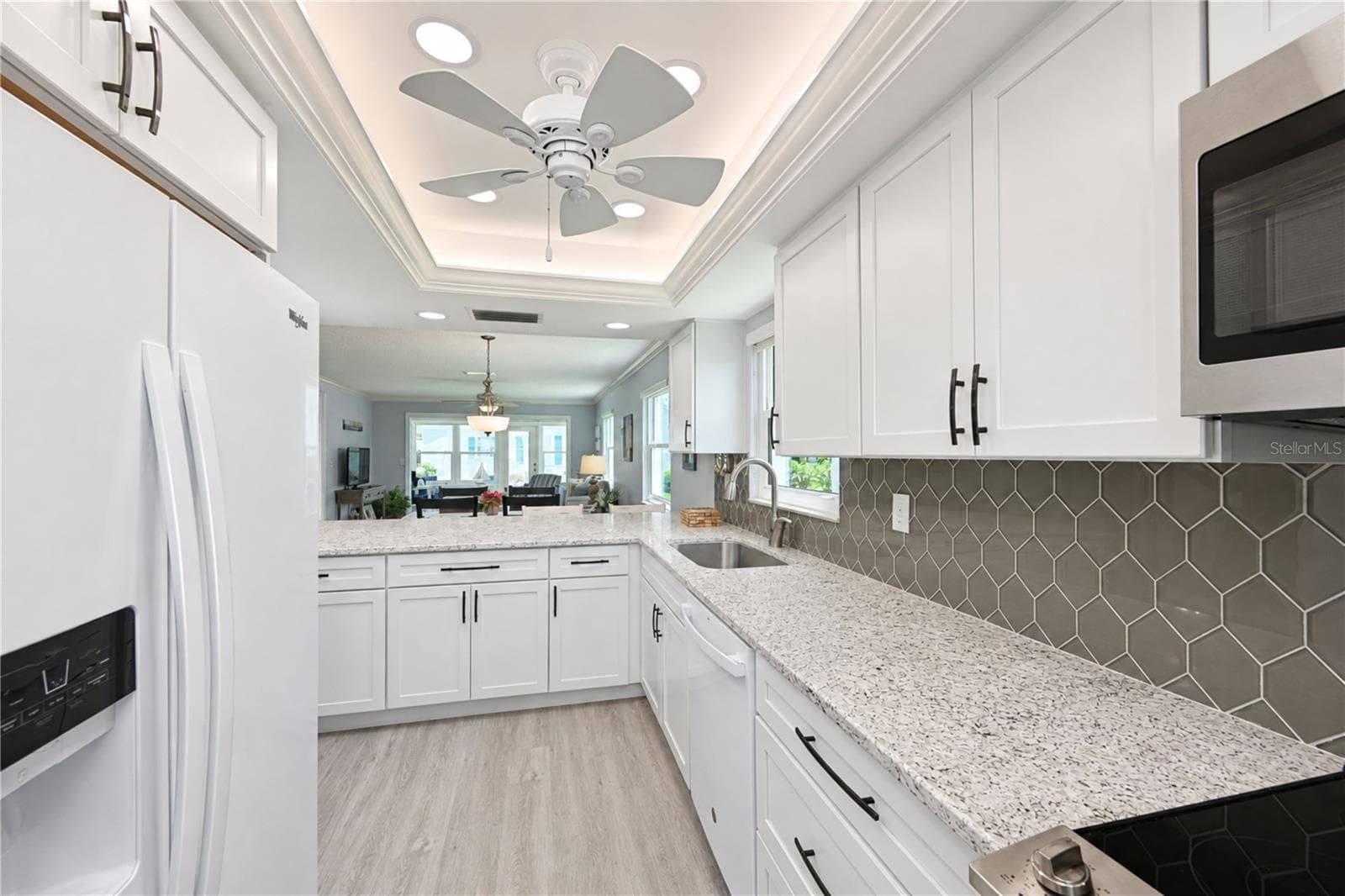 View of kitchen through villa to back - 9411 CONCORD CIR, BRADENTON