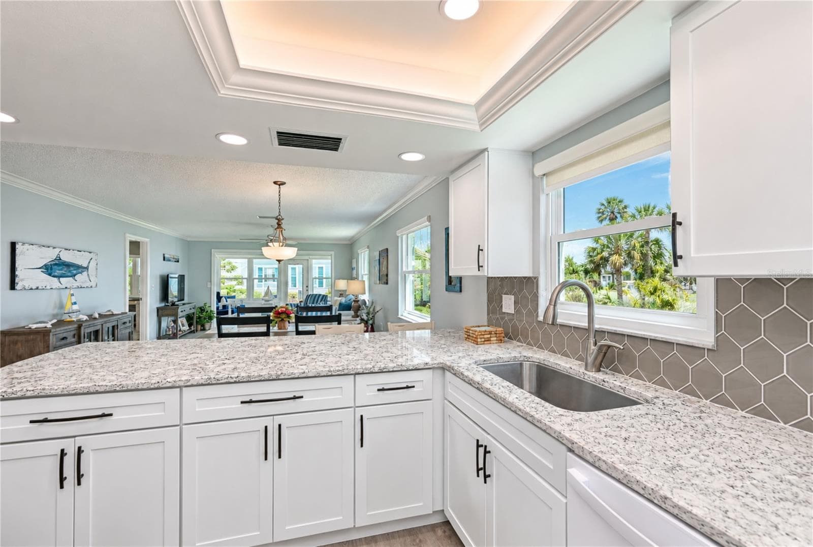 View of kitchen through villa to back - 9411 CONCORD CIR, BRADENTON