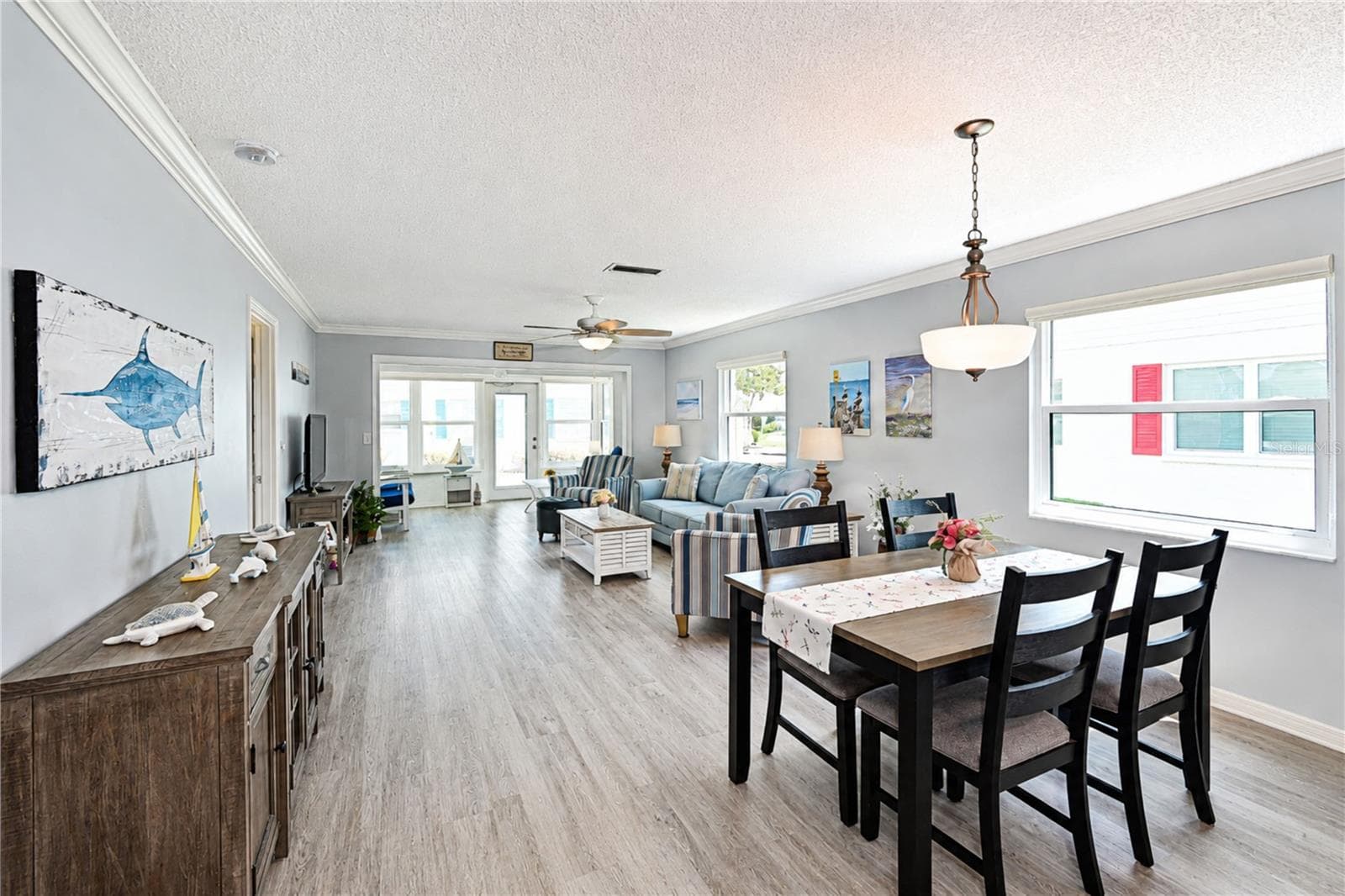 View of dining and living area - 9411 CONCORD CIR, BRADENTON