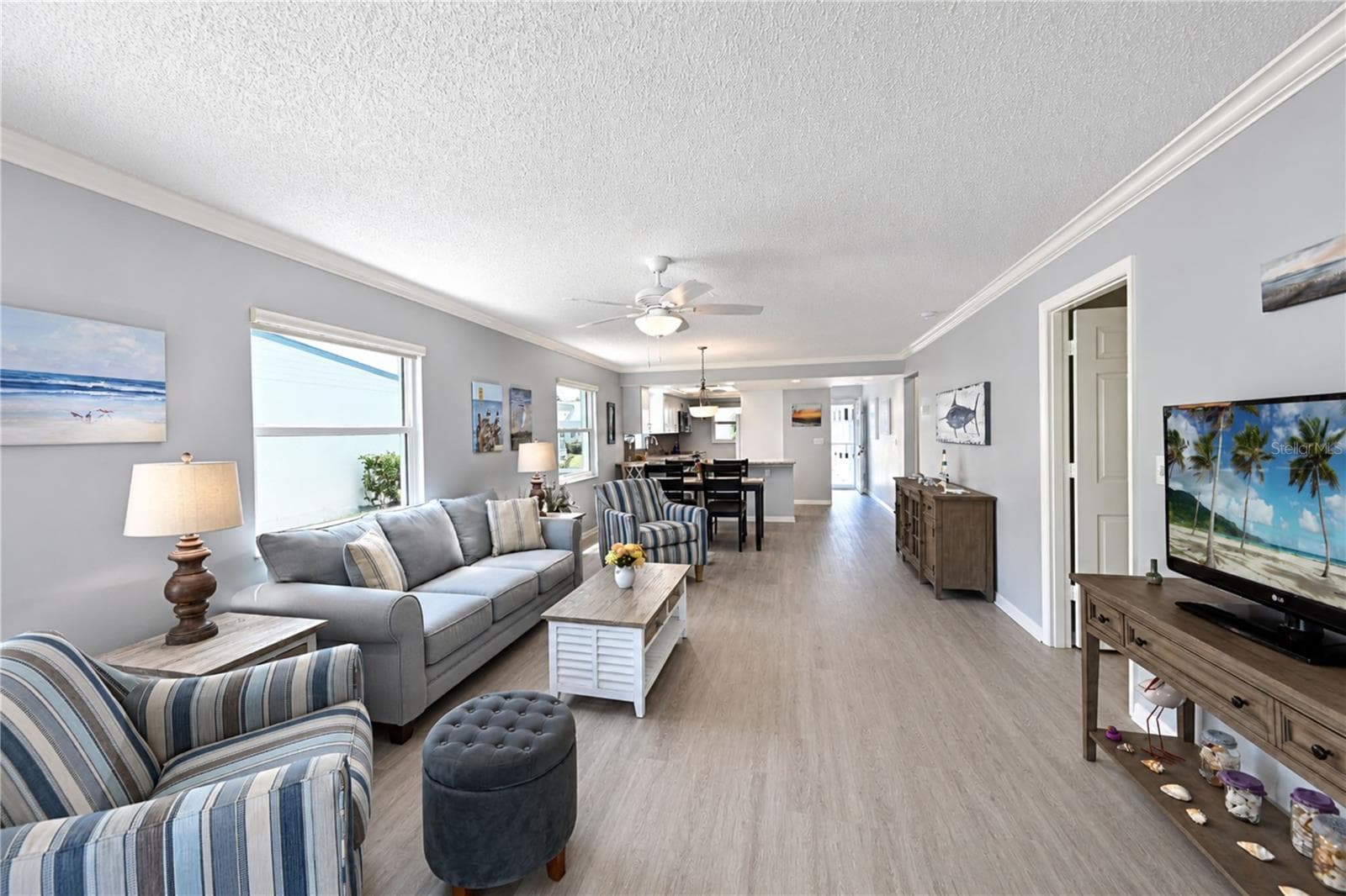 View through living room to front of villa - 9411 CONCORD CIR, BRADENTON