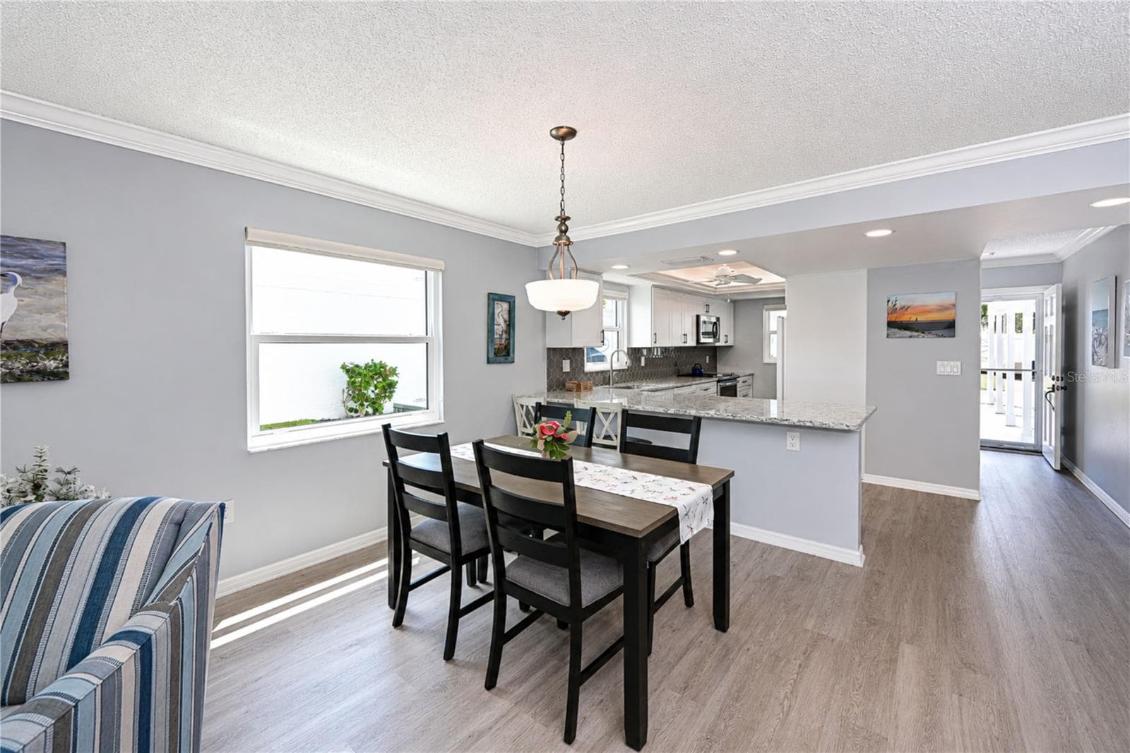 View of dining area to kitchen - 9411 CONCORD CIR, BRADENTON