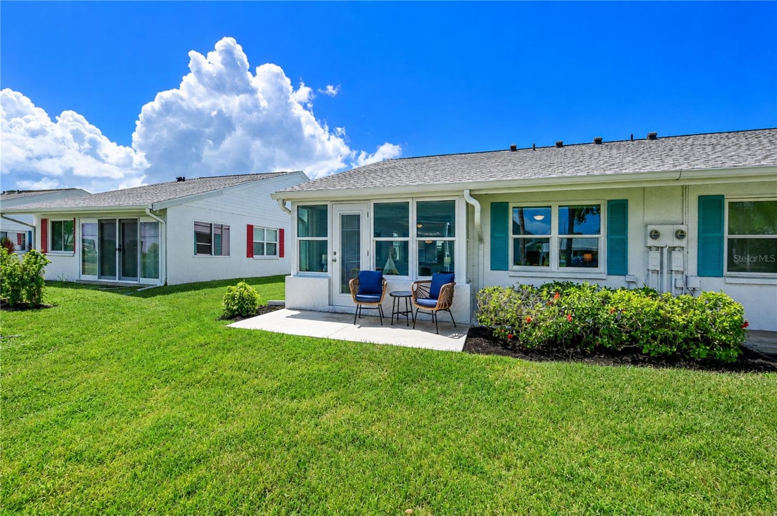 Back of villa with patio - 9411 CONCORD CIR, BRADENTON