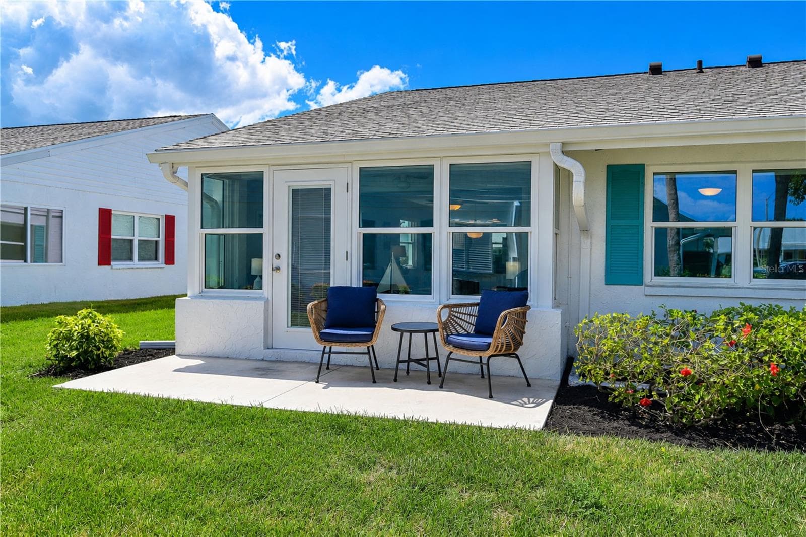 Back of villa with patio - 9411 CONCORD CIR, BRADENTON