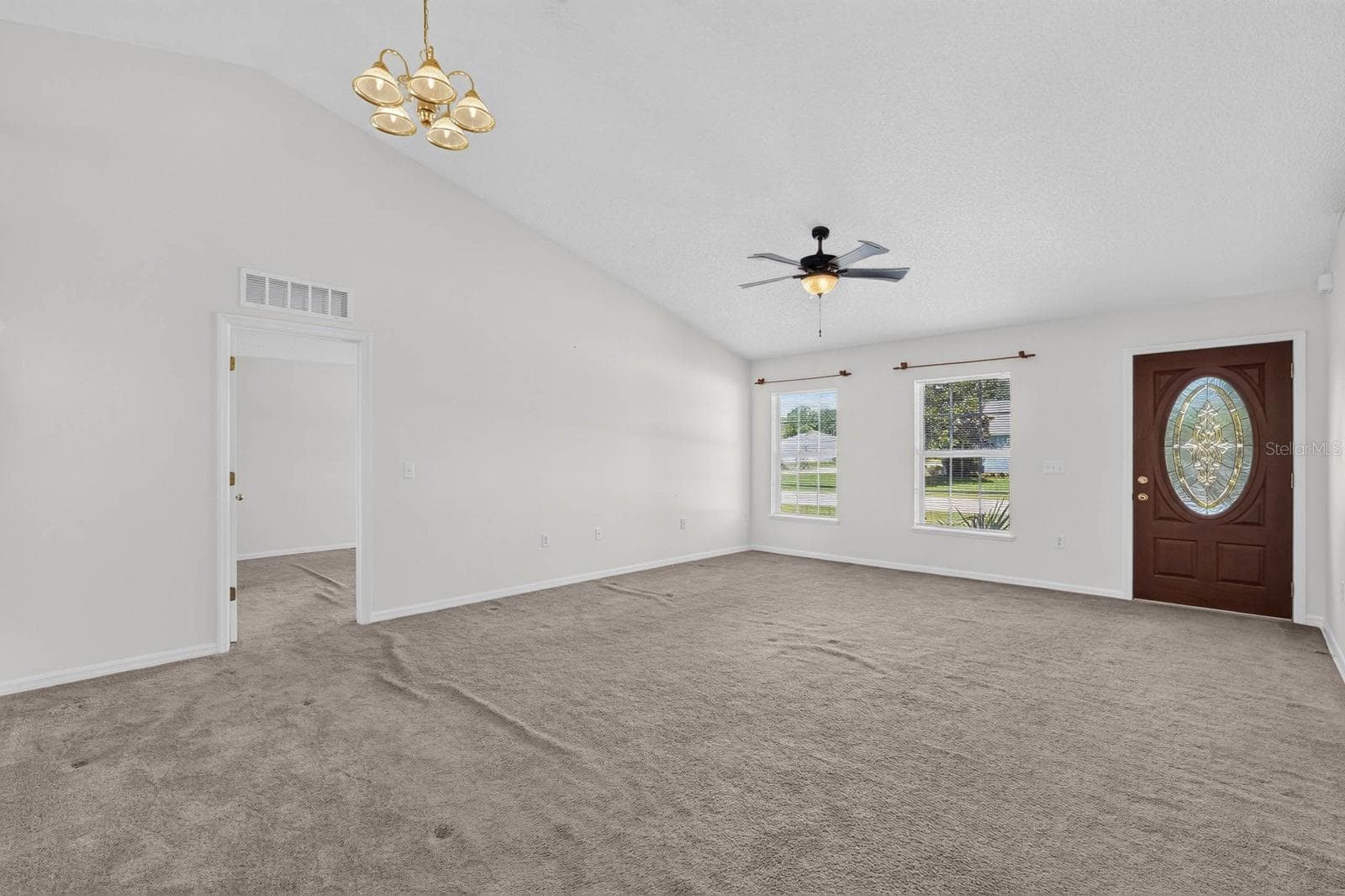 Front living room/dining room looking towards entrance - 99 PICKERING DR, PALM COAST