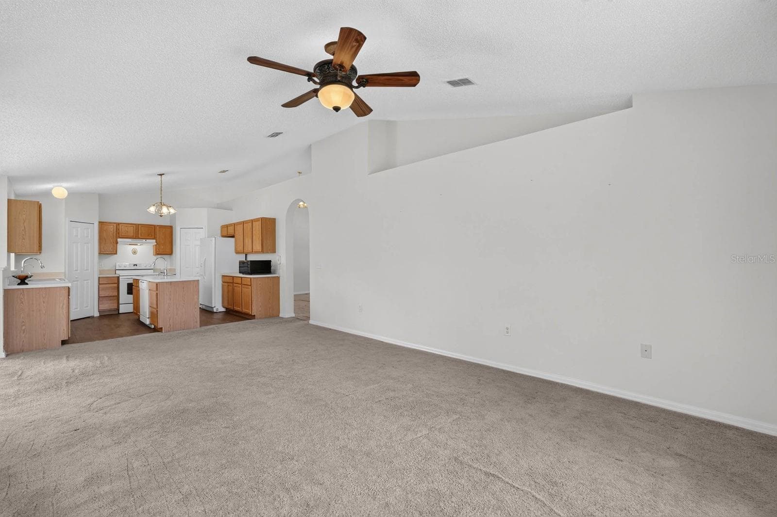Family Room looking towards the kitchen - 99 PICKERING DR, PALM COAST