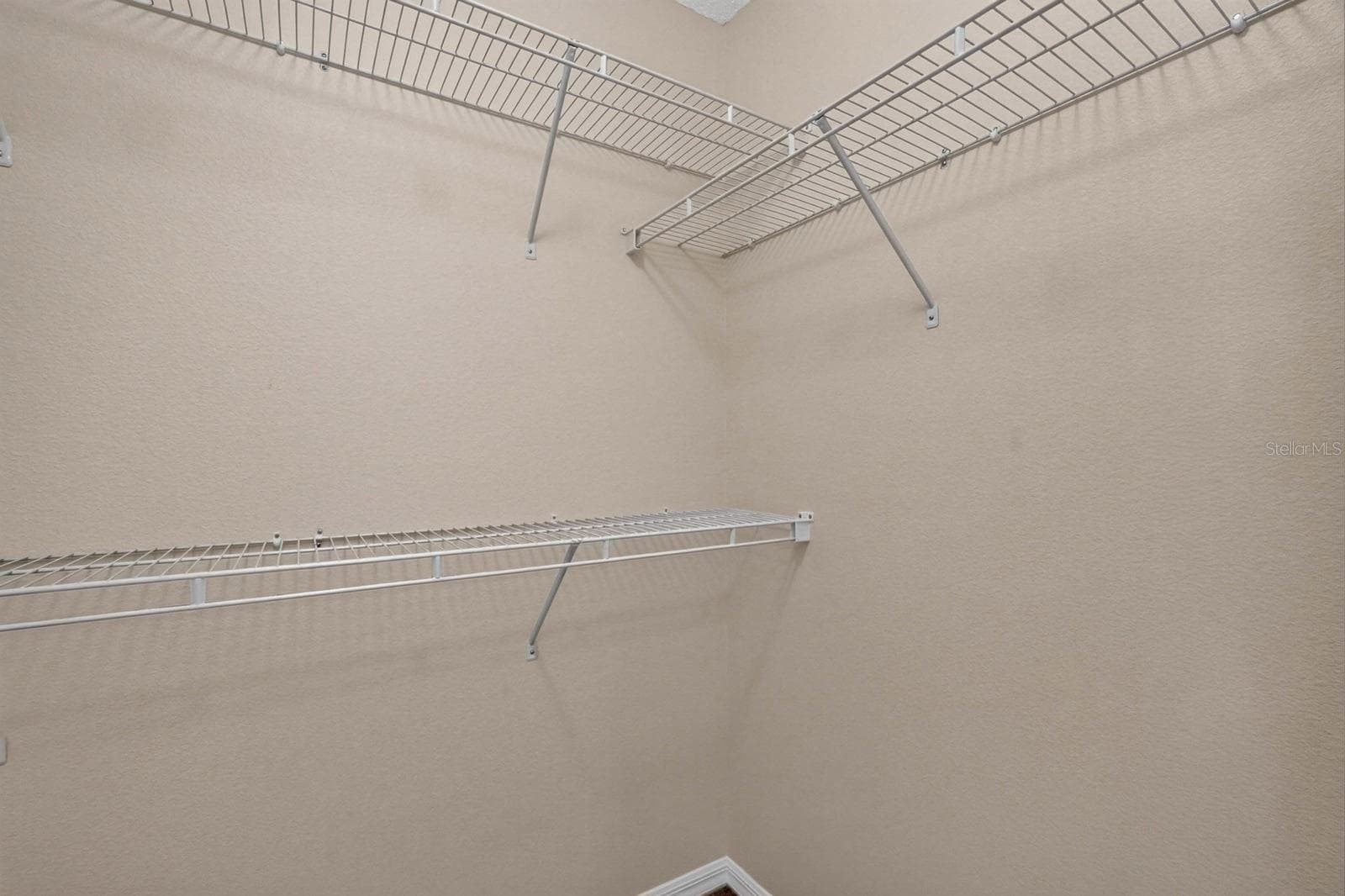 walk-in closet primary suite - 99 PICKERING DR, PALM COAST