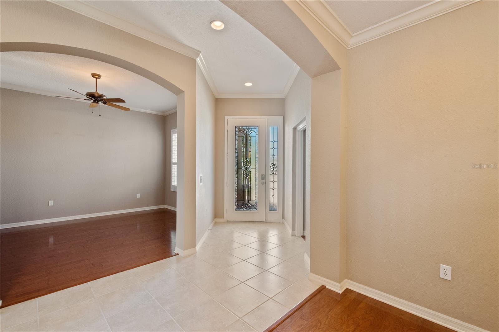 The home features extensive tile flooring with some rooms boasting engineered wood flooring. - 2464 LAUREL GLEN DR, LAKELAND