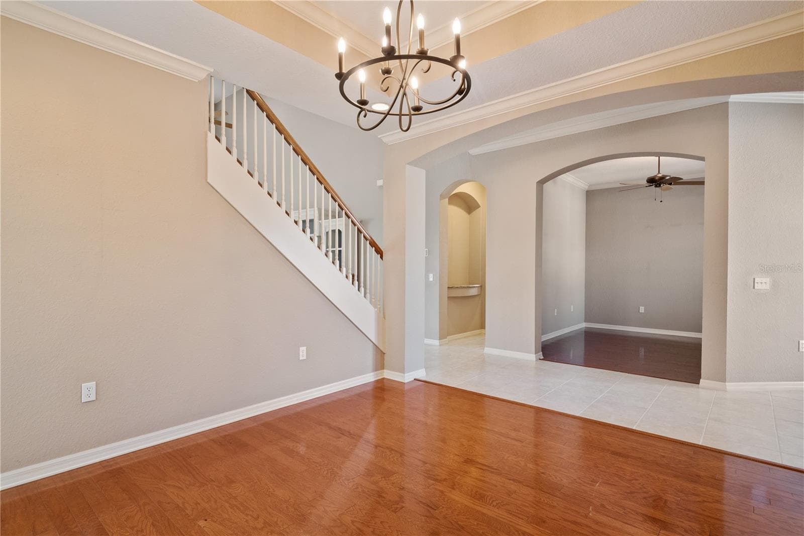 The open stairway overlooks the dining room and ends at the greatroom . - 2464 LAUREL GLEN DR, LAKELAND