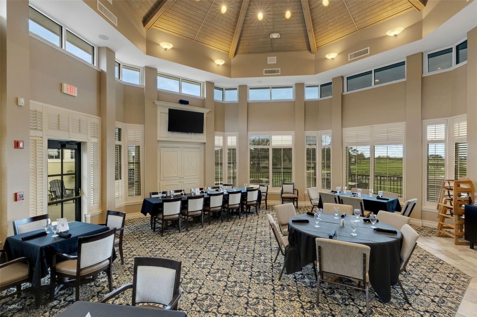 The Grill Room is more casual and has beautiful view of the golf course beyond. - 2464 LAUREL GLEN DR, LAKELAND