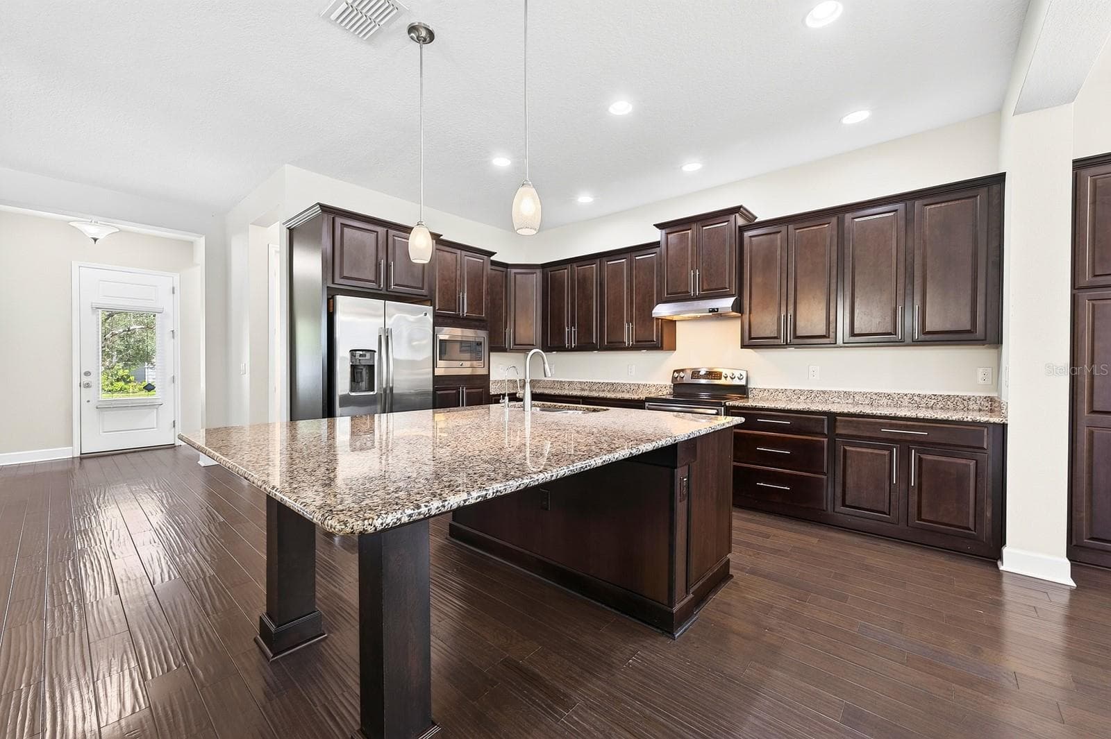 Beautifully designed and thoughtfully upgraded, this Huxley Grande model by Minto offers 3 bedrooms, a dedicated OFFICE/FLEX SPACE, 2-full and 1-half baths, and a 2-CAR REAR FACING GARAGE, all wrapped in the LOW MAINTENANCE lifestyle Laureate Park is known for. - 8130 LAUREATE BLVD, ORLANDO
