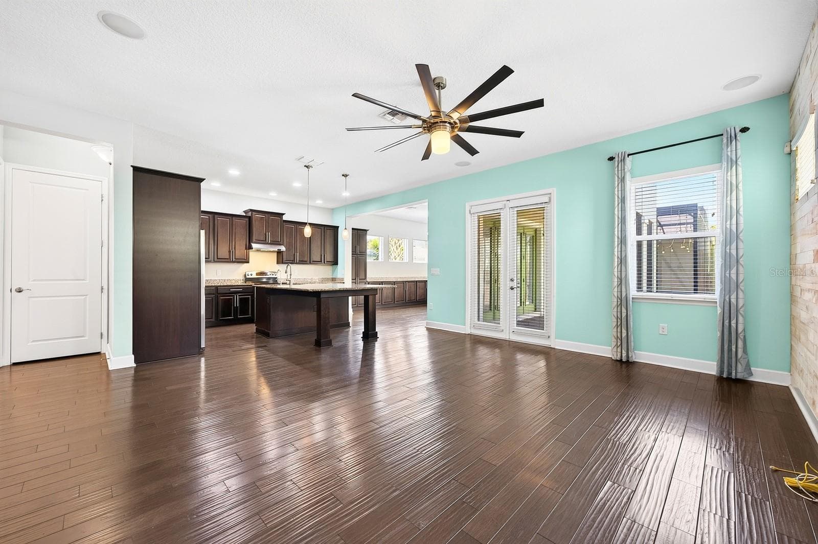The OPEN CONCEPT living, dining, and kitchen spaces are filled with NATURAL LIGHT and designed for effortless everyday living and entertaining. - 8130 LAUREATE BLVD, ORLANDO