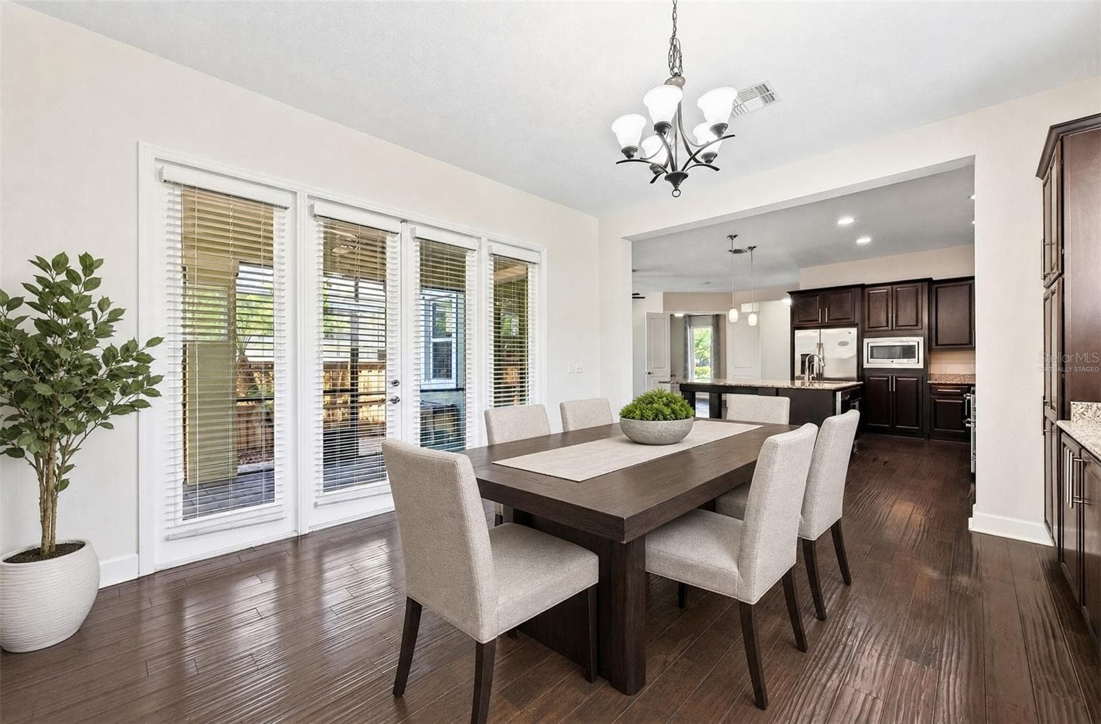 Light filled formal dining. Virtually Staged. - 8130 LAUREATE BLVD, ORLANDO