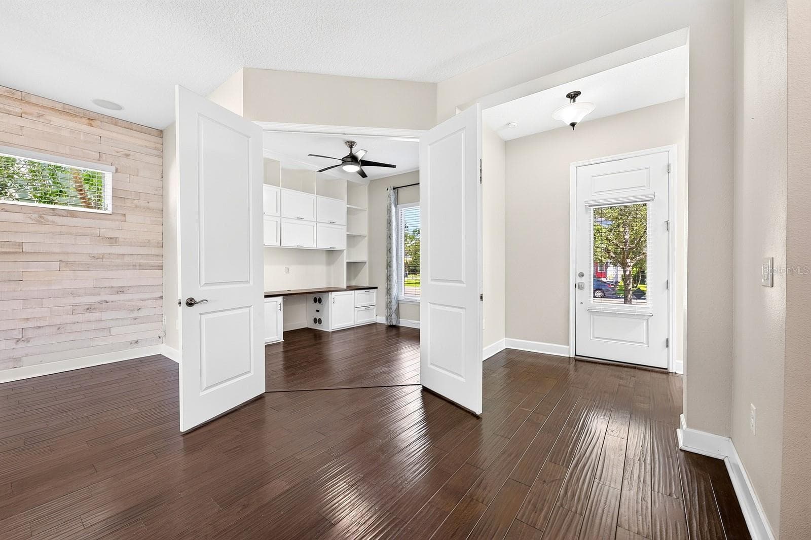 Double doors open to the office/flex space off the foyer. - 8130 LAUREATE BLVD, ORLANDO