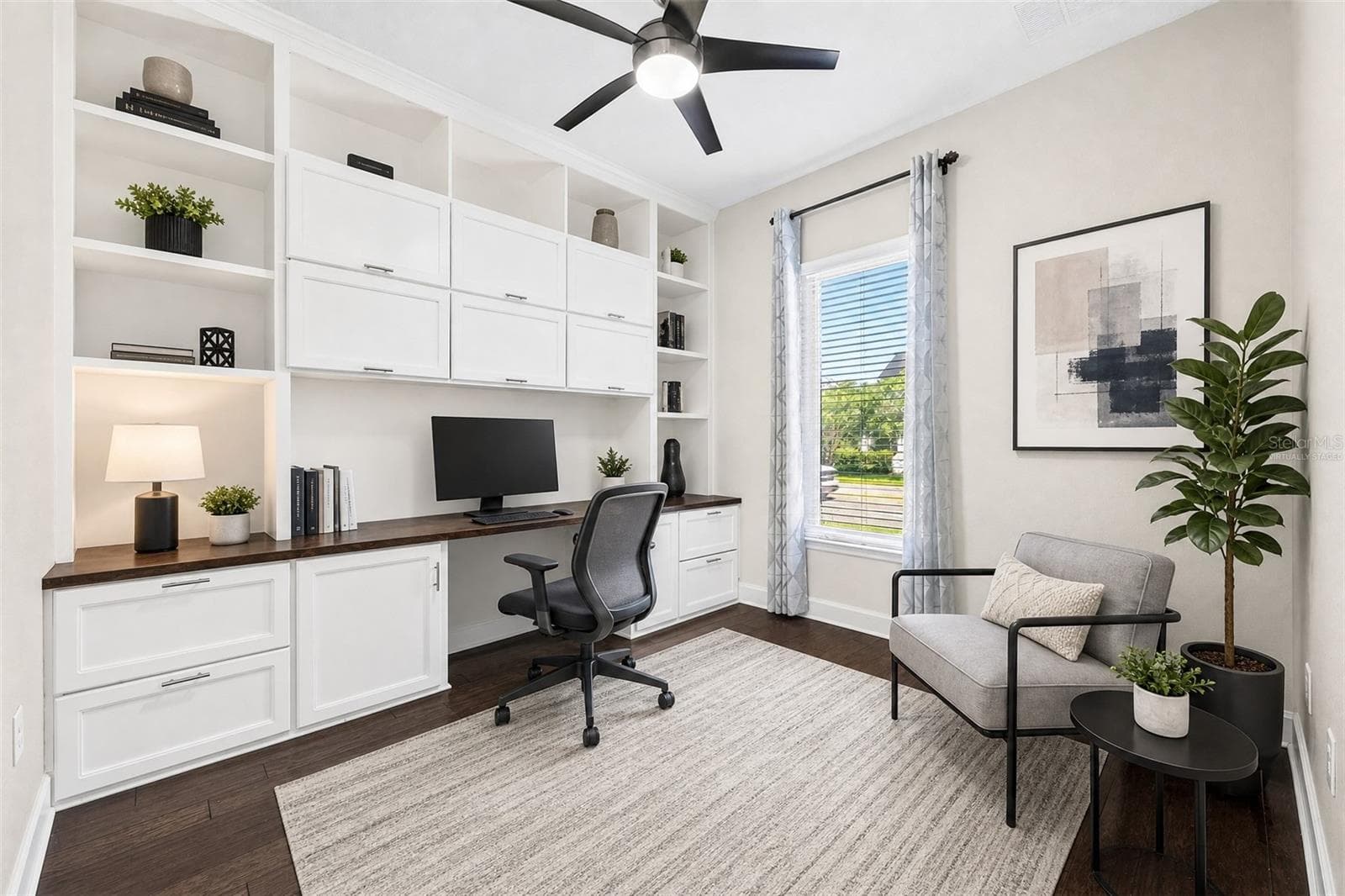 Office/flex space at the front of the home features custom built-ins. Virtually Staged. - 8130 LAUREATE BLVD, ORLANDO