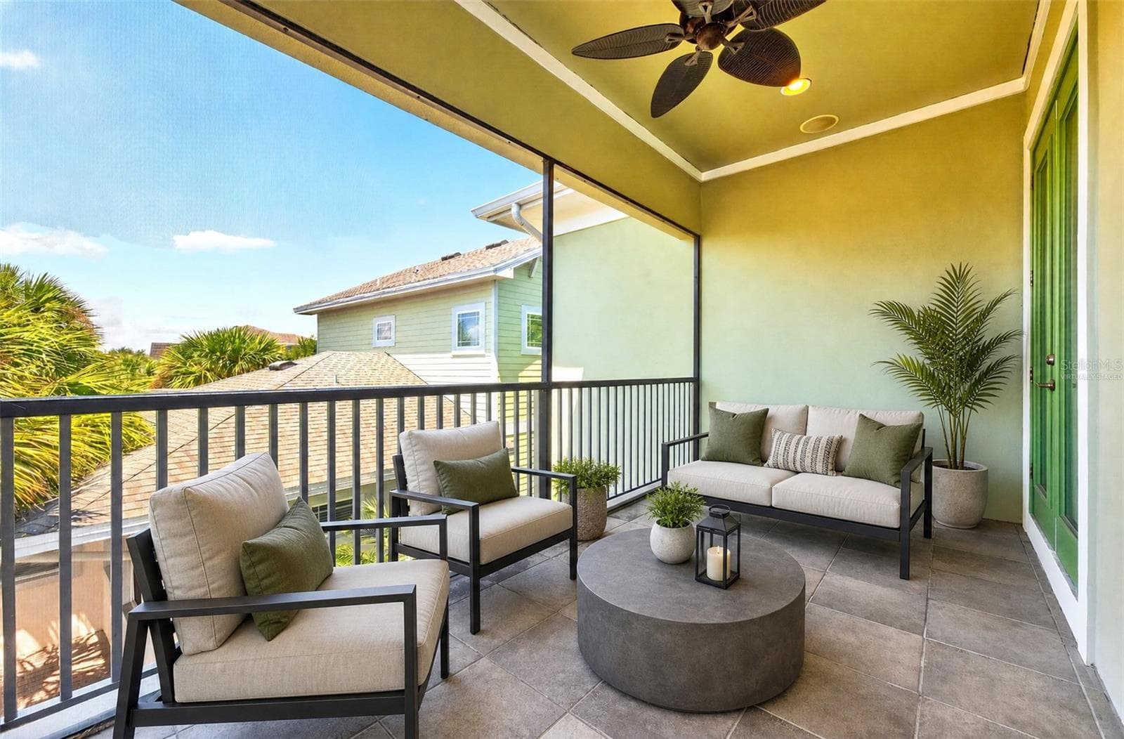 Your primary suite is complete with a private balcony. Virtually Staged. - 8130 LAUREATE BLVD, ORLANDO