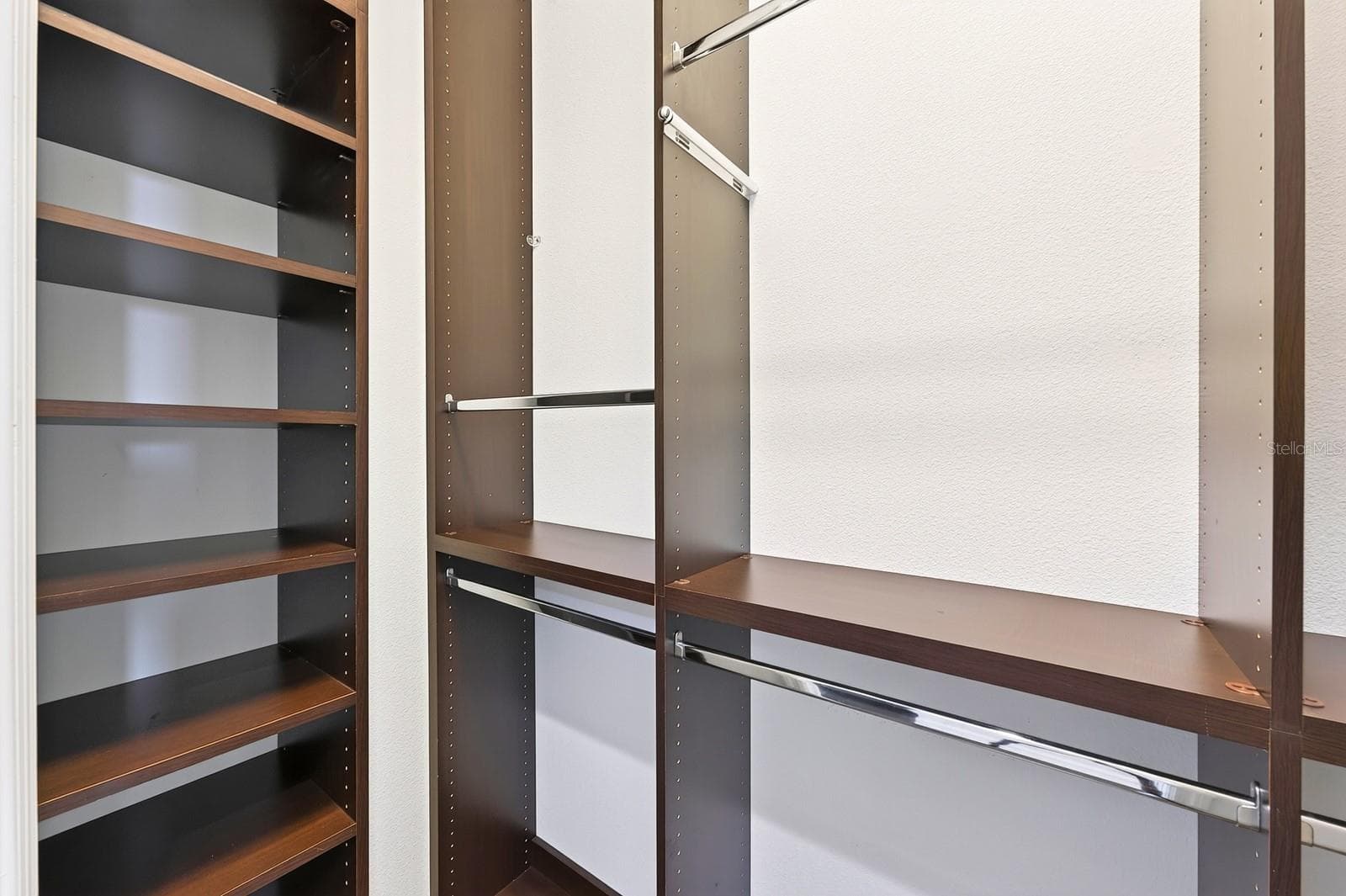 Custom storage in the dual walk-in closets. - 8130 LAUREATE BLVD, ORLANDO