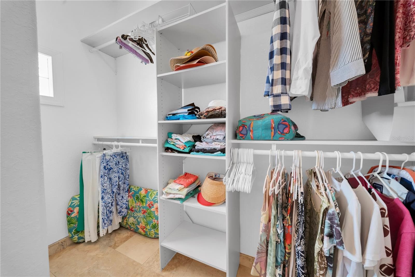One side of Primary walk in closet - 16102 4TH ST E, REDINGTON BEACH