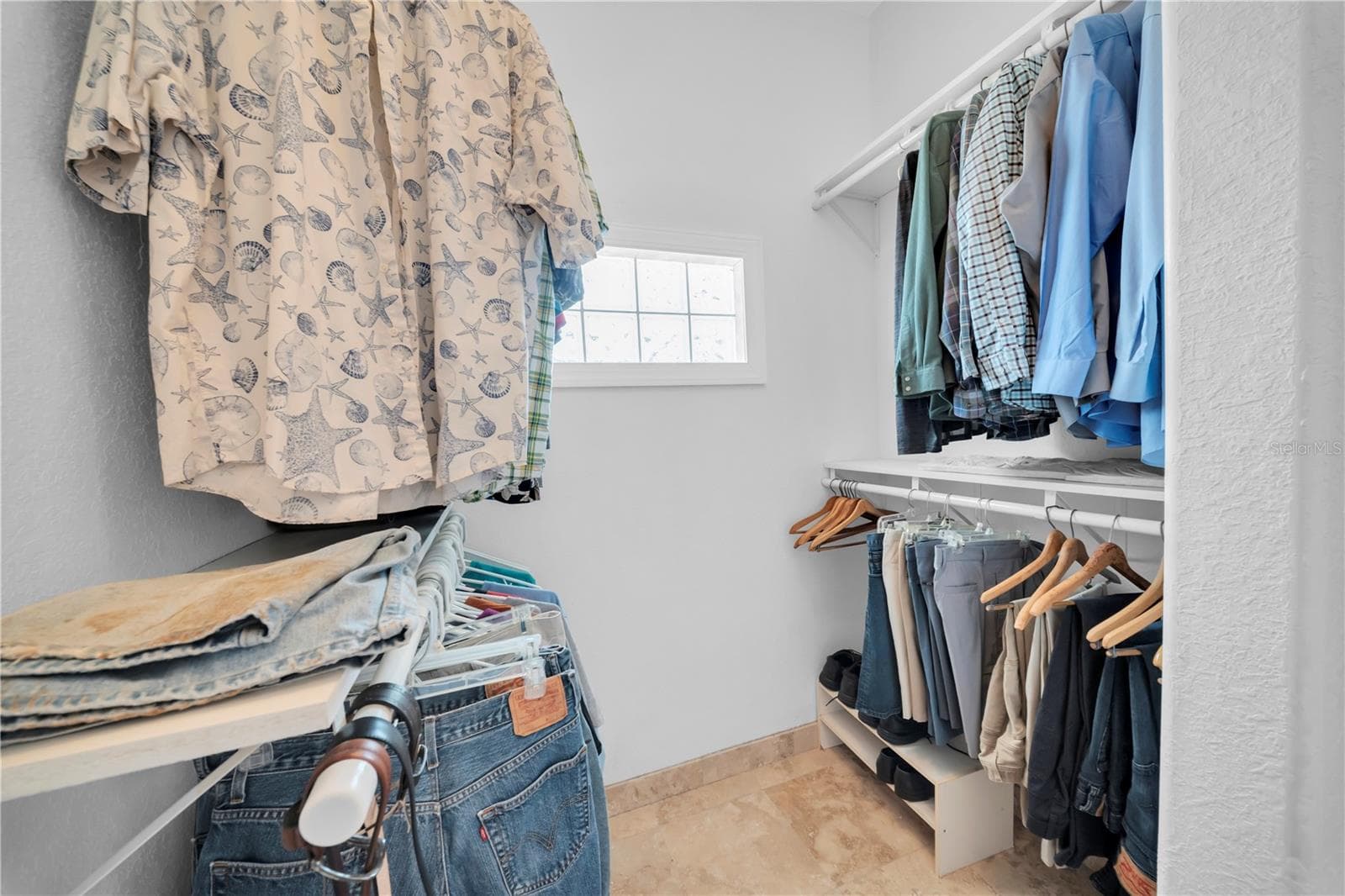 One side of Primary walk in closet - 16102 4TH ST E, REDINGTON BEACH