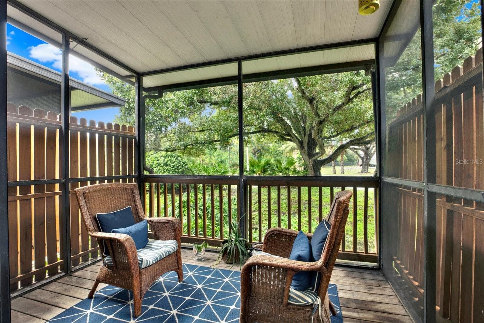 Screen Enclosed for Year round enjoyment nestled under an Oak Tree.. Relax and watch the horses walk past throughout the day - 6311 93RD TER N #4403, PINELLAS PARK