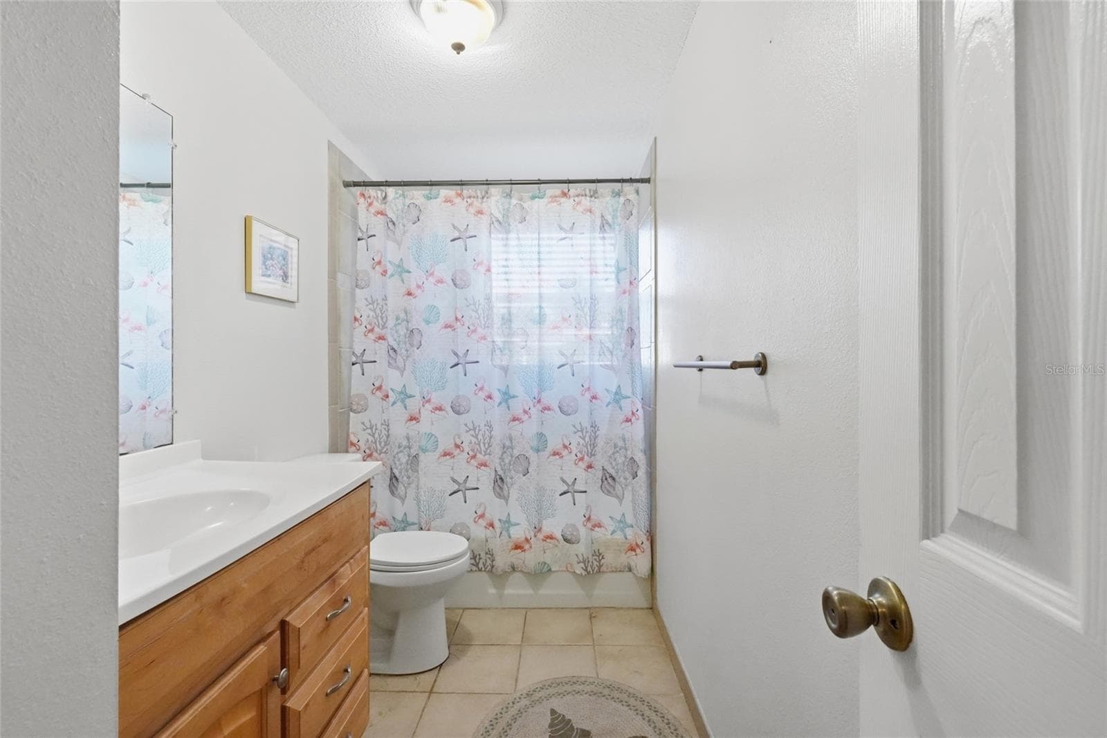 Guest bathroom features a tub/shower - 5008 27TH AVE W, BRADENTON
