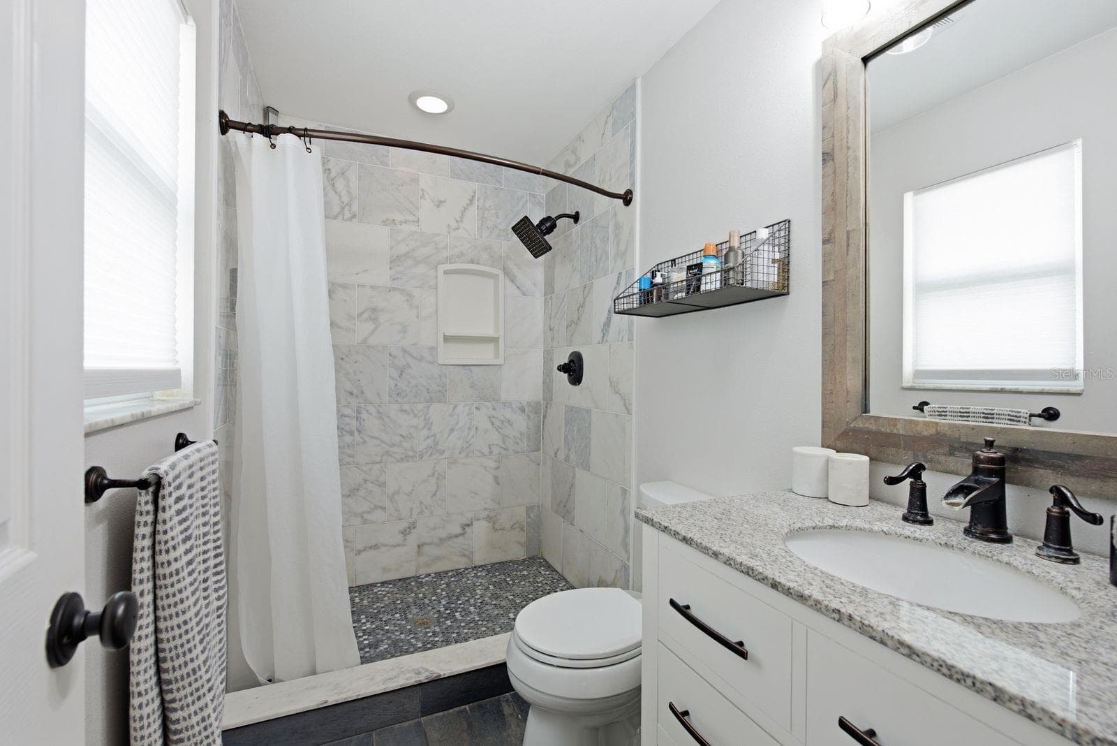 Updated bath with a large walk in shower. - 12620 115TH ST, LARGO