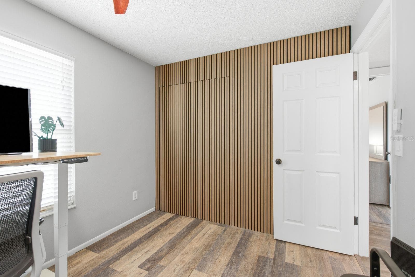 Custom wood slat accent wall brings the WOW. - 12620 115TH ST, LARGO