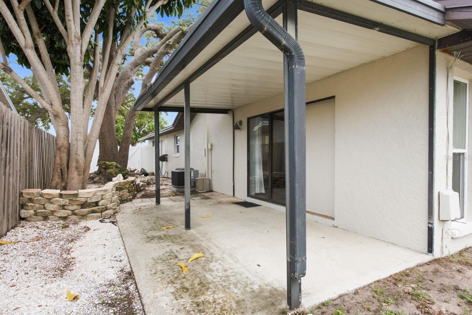 Covered patio + your own private backyard retreat. - 12620 115TH ST, LARGO