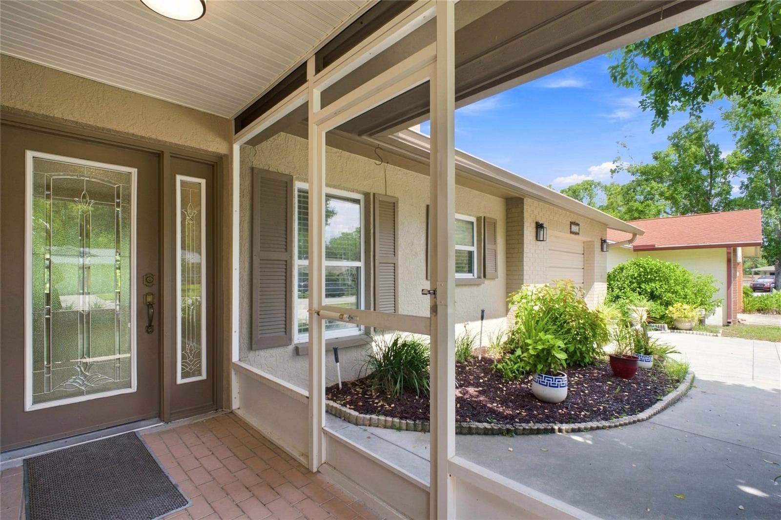 Welcoming front screened entry and new glass door~ - 2336 MALCOLM DR, PALM HARBOR