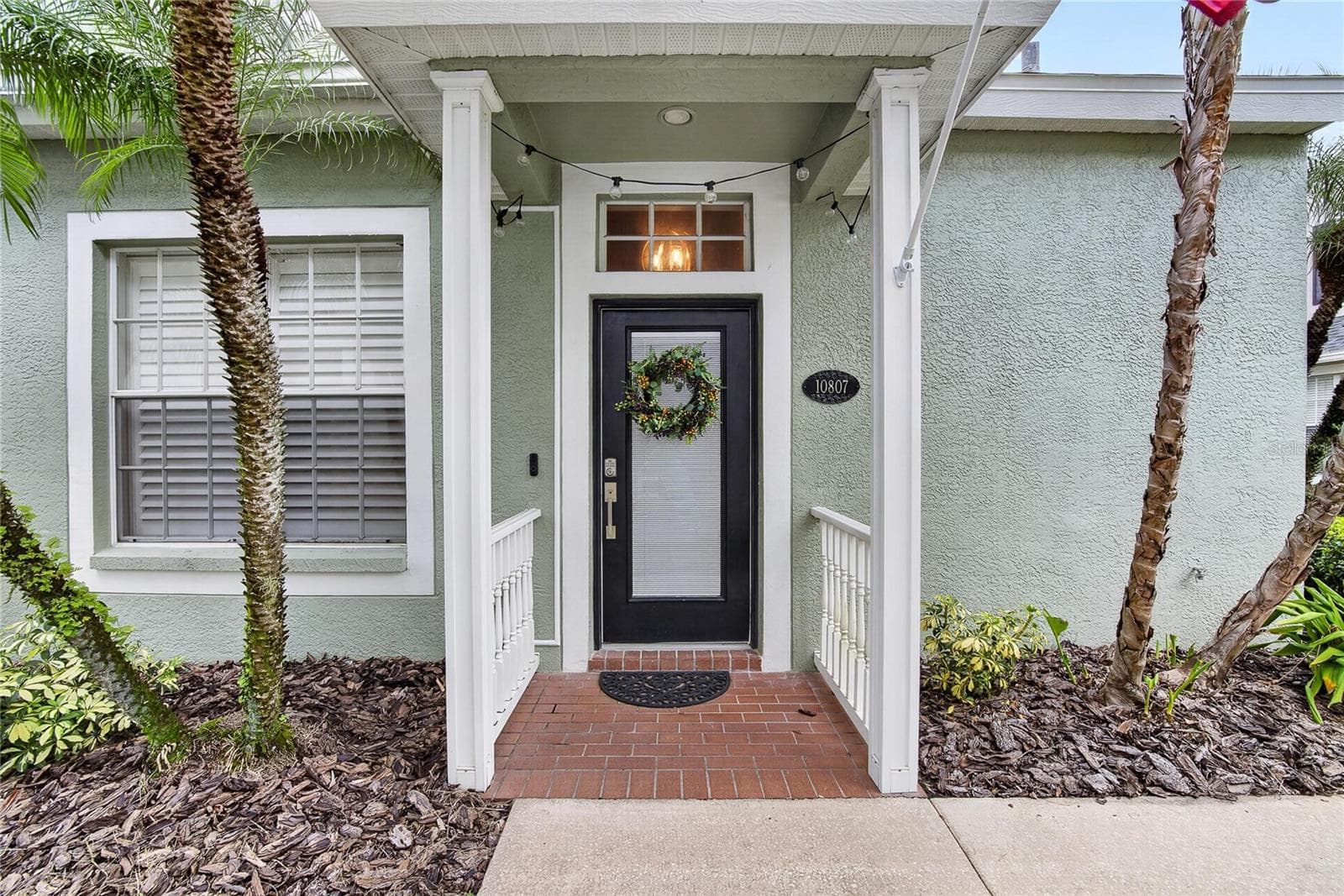 Charming covered front entry welcomes you home. - 10807 SIERRA VISTA PL, TAMPA
