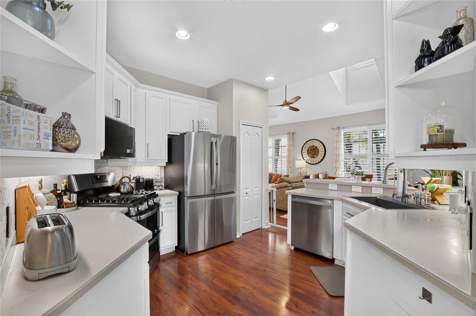 Open kitchen design with stainless steel appliances, abundant cabinetry and views into the living area. - 10807 SIERRA VISTA PL, TAMPA