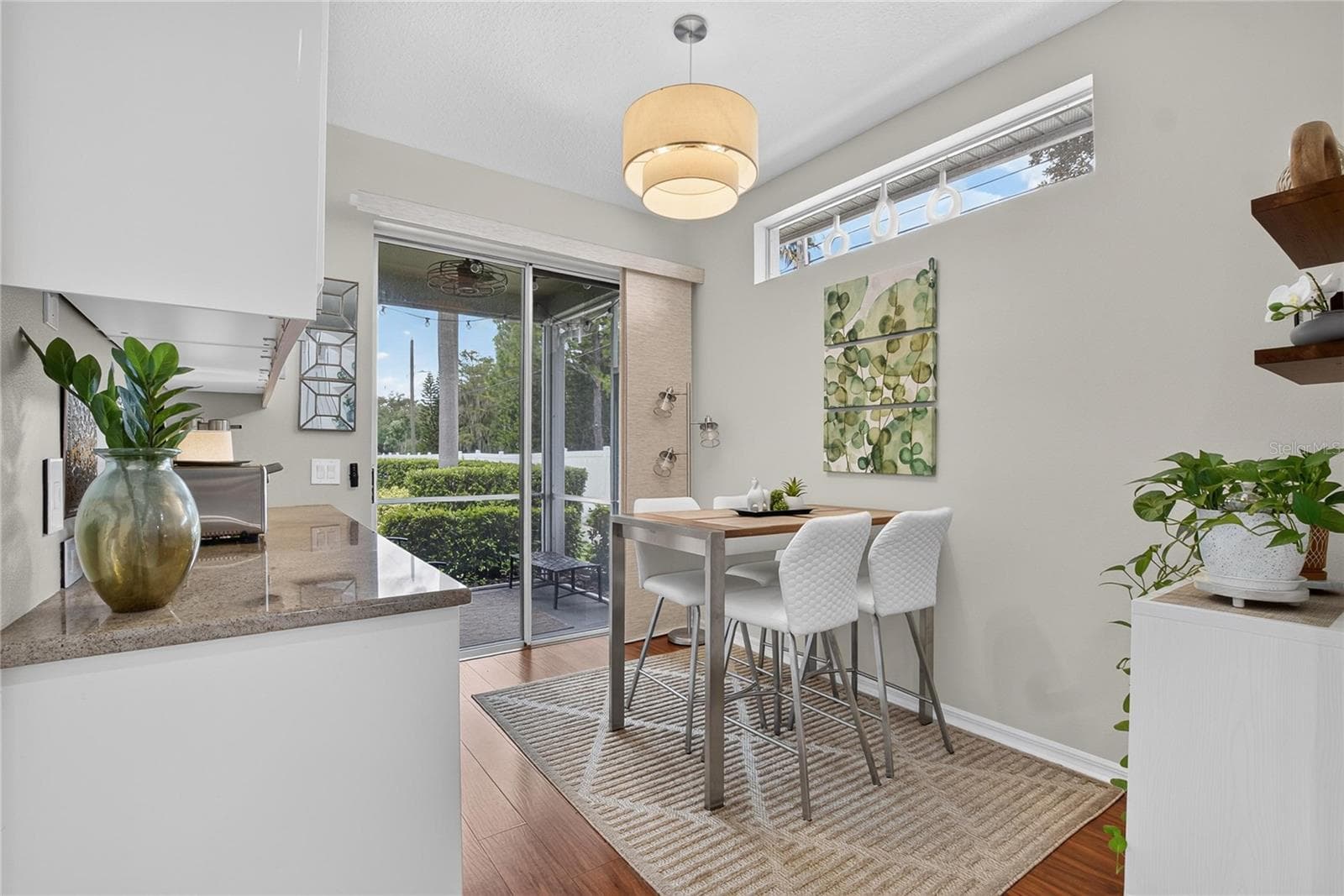 Sunny breakfast nook with high ceilings and direct access to the screened lanai - 10807 SIERRA VISTA PL, TAMPA