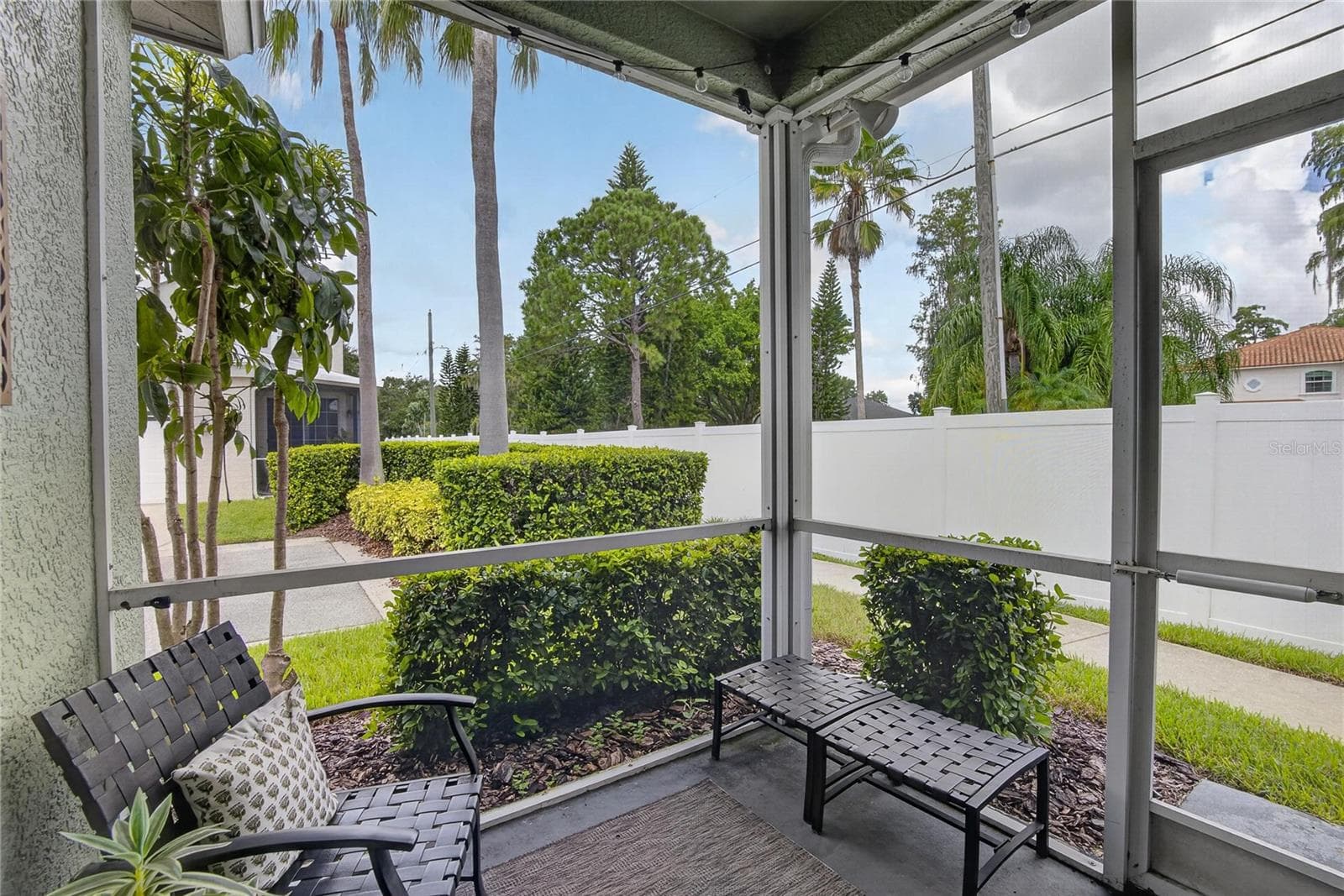 Cozy screened lanai offers a private spot to relax and enjoy the Florida outdoors - 10807 SIERRA VISTA PL, TAMPA