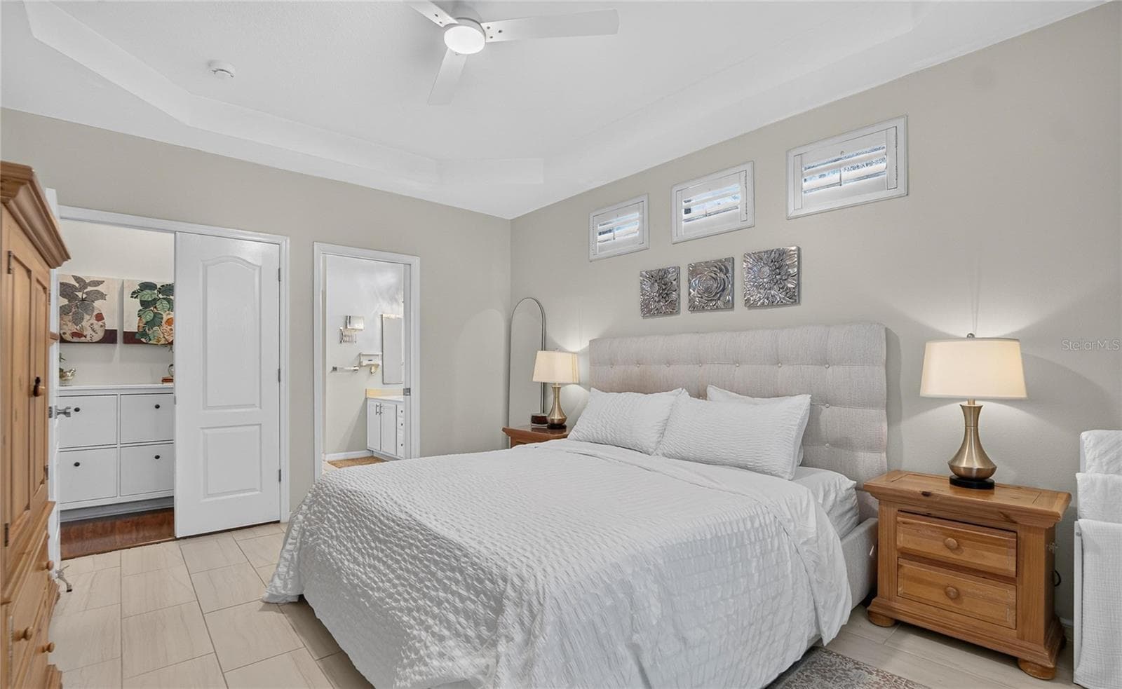 Generous primary suite with direct access to the walk-in closet and private bath. - 10807 SIERRA VISTA PL, TAMPA