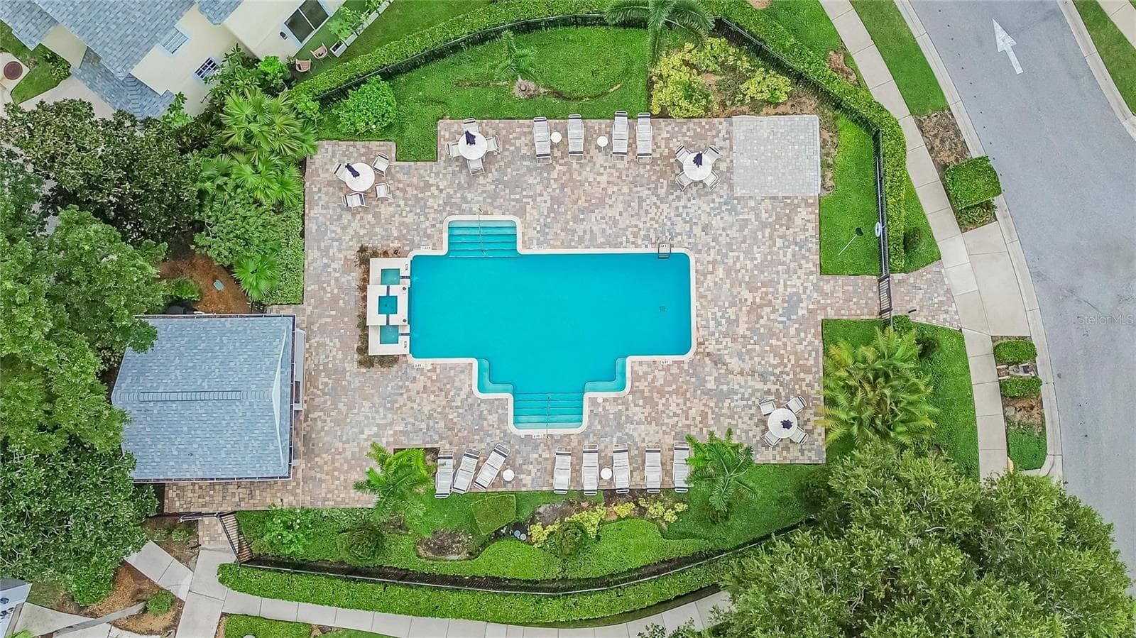 Community pool with expansive paver deck and plenty of space to relax and enjoy the Florida sunshine. - 10807 SIERRA VISTA PL, TAMPA