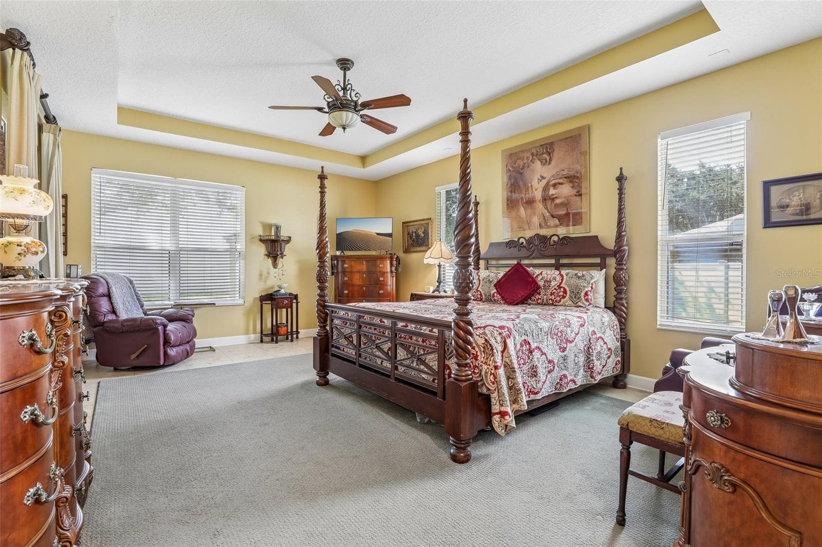 Generous main floor primary suite has direct access to the lanai. - 2431 PONKAN SUMMIT DR, APOPKA