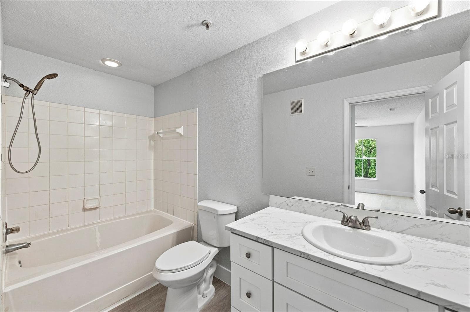 Bedroom 1 ensuite full bath NEW cabinet toilet showerhead - 18001 RICHMOND PLACE DR #136, TAMPA