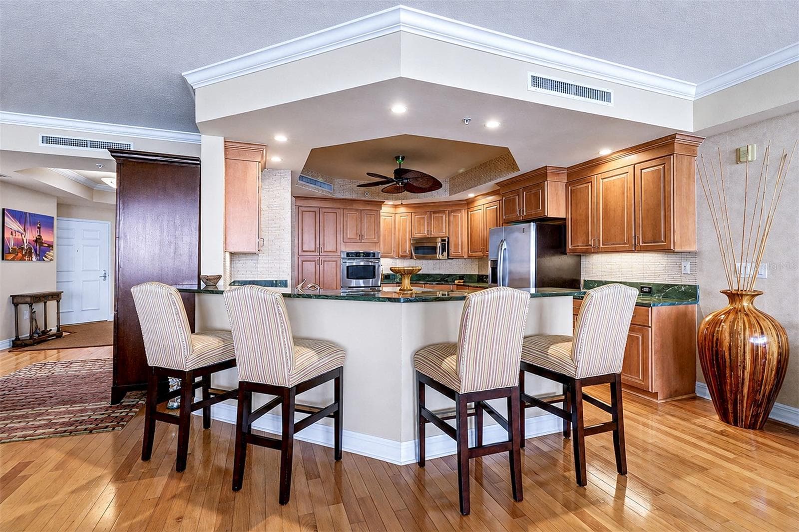... Kitchen Size  in Perfect Proportion to Great Room . Wood Floors Thru Out Unit Provide a Warm Coastal Comfortable Living Atmosphere. - 15208 GULF BLVD #404, MADEIRA BEACH
