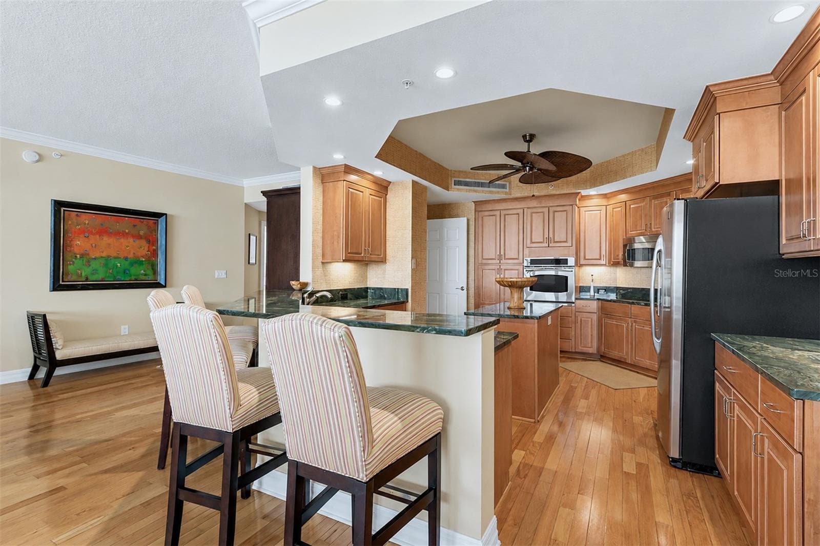 ... Kitchen Has Updated Granite - Tons of Cabinetry Space - Prep Island - GE Stainless Appliance Package & Newly Refurbished Bar Stools. - 15208 GULF BLVD #404, MADEIRA BEACH