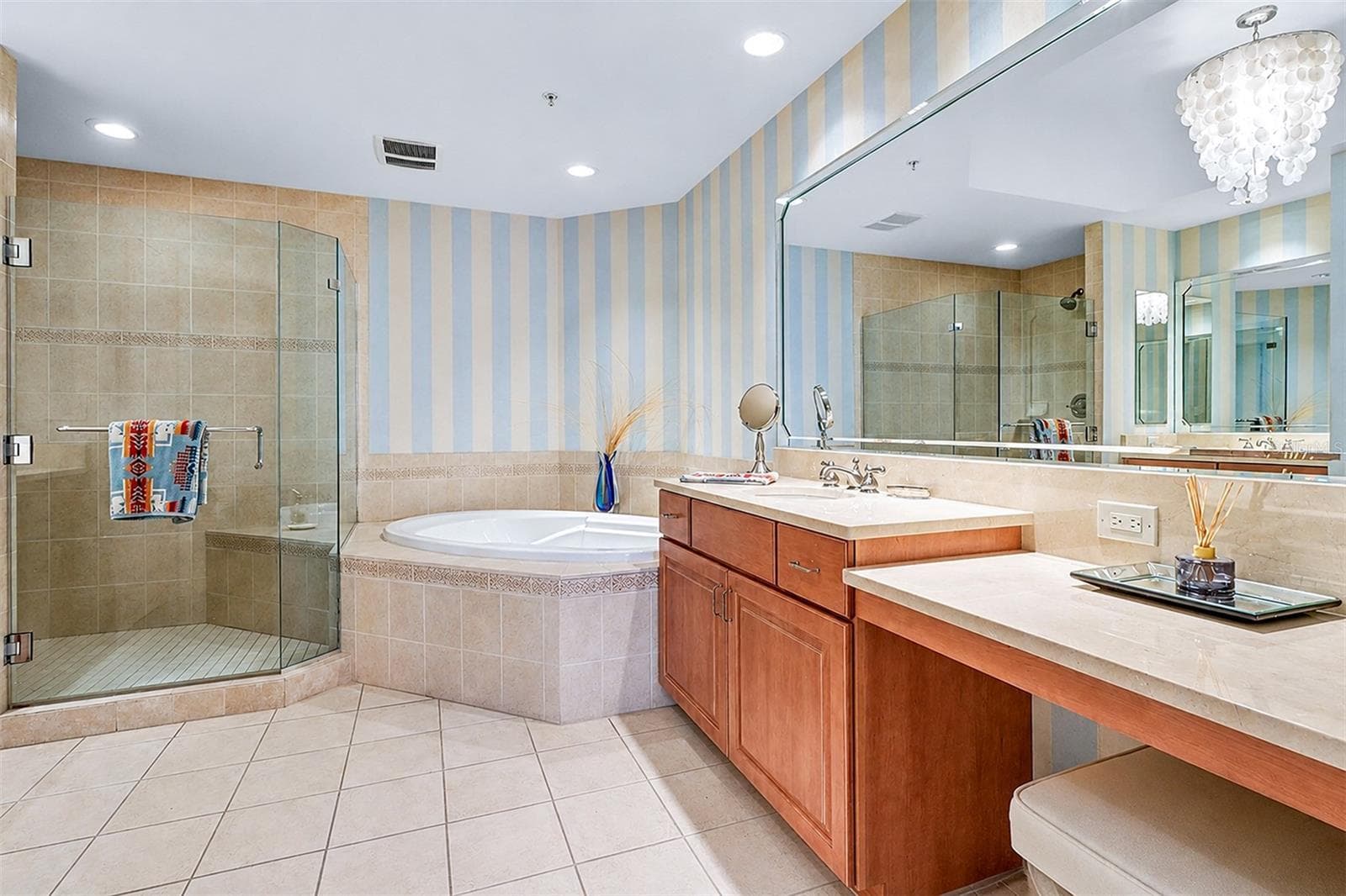 ... Primary / Master Bathroom.. 13.2 X 12.3... Double Vanities .... Soaking Tub .... Walk In Shower W/ Bench. - 15208 GULF BLVD #404, MADEIRA BEACH