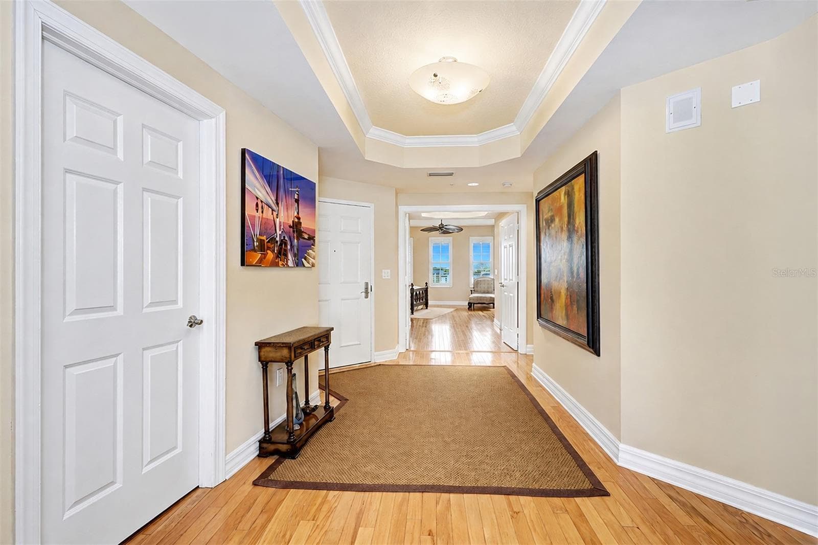 . Hallway - Looking out From Living Room Area .. Laundry Room to Left - Entrance Door on Far Left.. Main Guest Suite Thru Double Parlor Doors.. NOTE: All Interior Doors are Solid Core.. - 15208 GULF BLVD #404, MADEIRA BEACH