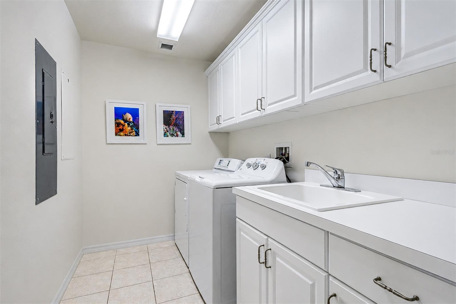 ... Large Laundry Room 9'6"  X 6' is Located off the Kitchen Area in the Transitional Space Separating the Front Part of the Condo and the Guest Quarters in the Rear. - 15208 GULF BLVD #404, MADEIRA BEACH