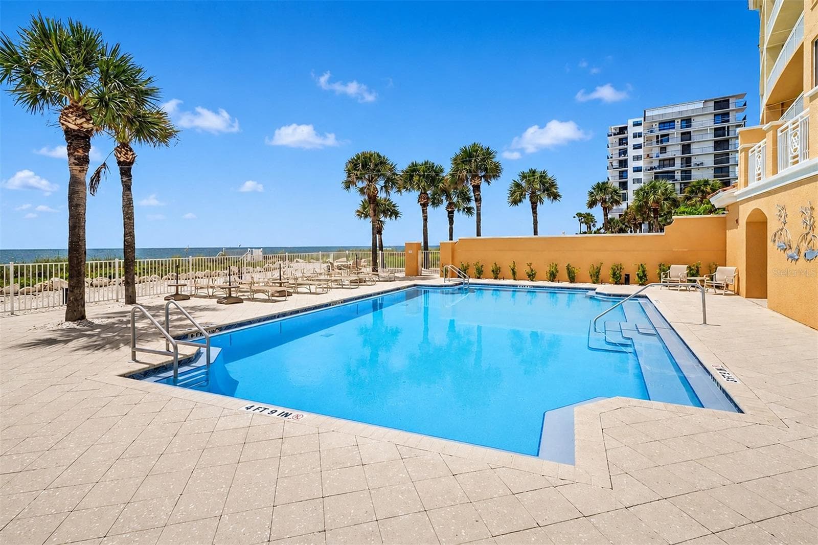 ... Gulf front Heated Pool Looking NW ....Numerous Lounging Areas.. - 15208 GULF BLVD #404, MADEIRA BEACH