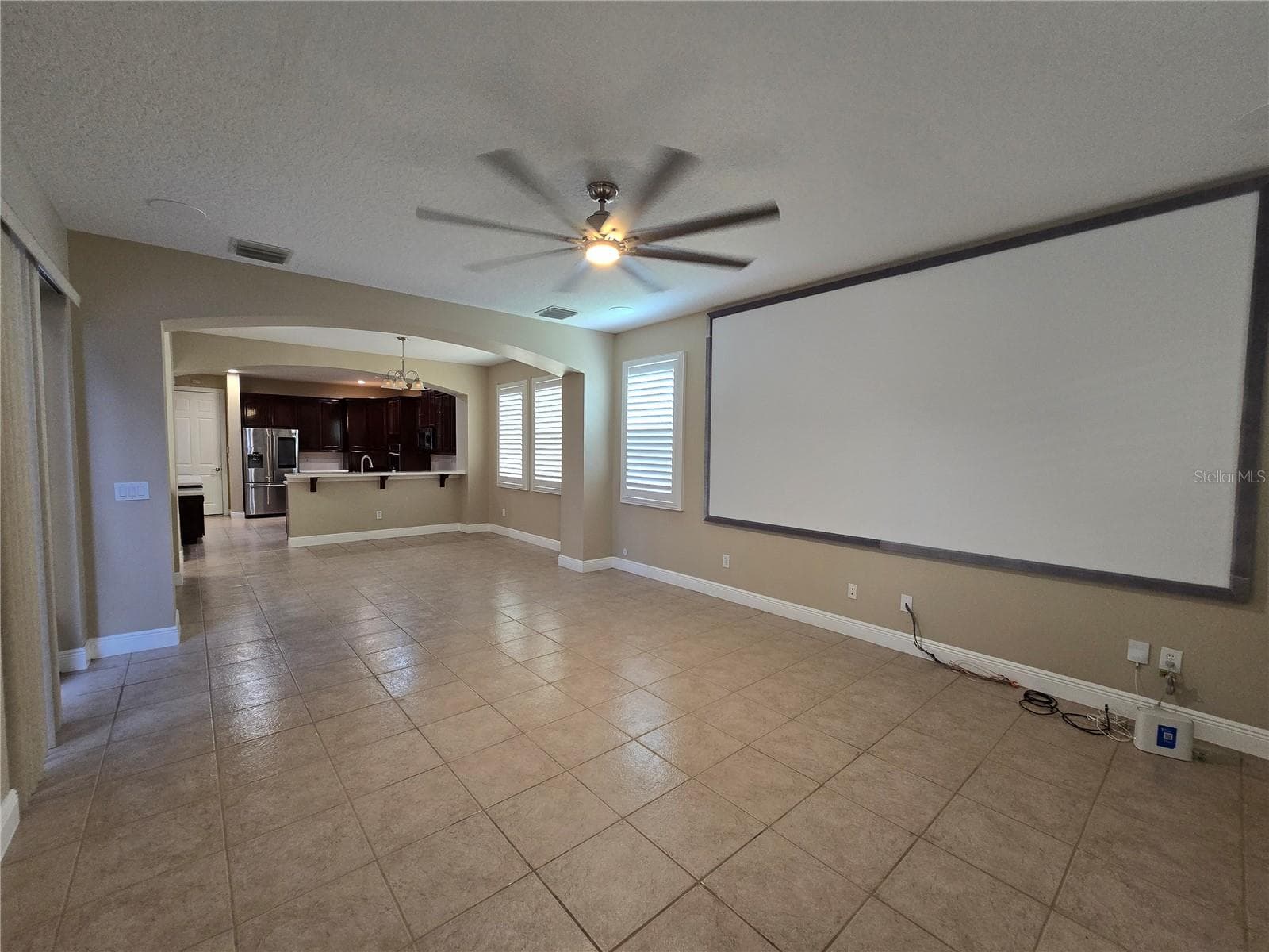View from great room towards dining/breakfast space and kitchen. Architectural features and plantation shutters. - 3405 HEIRLOOM ROSE PL, OVIEDO