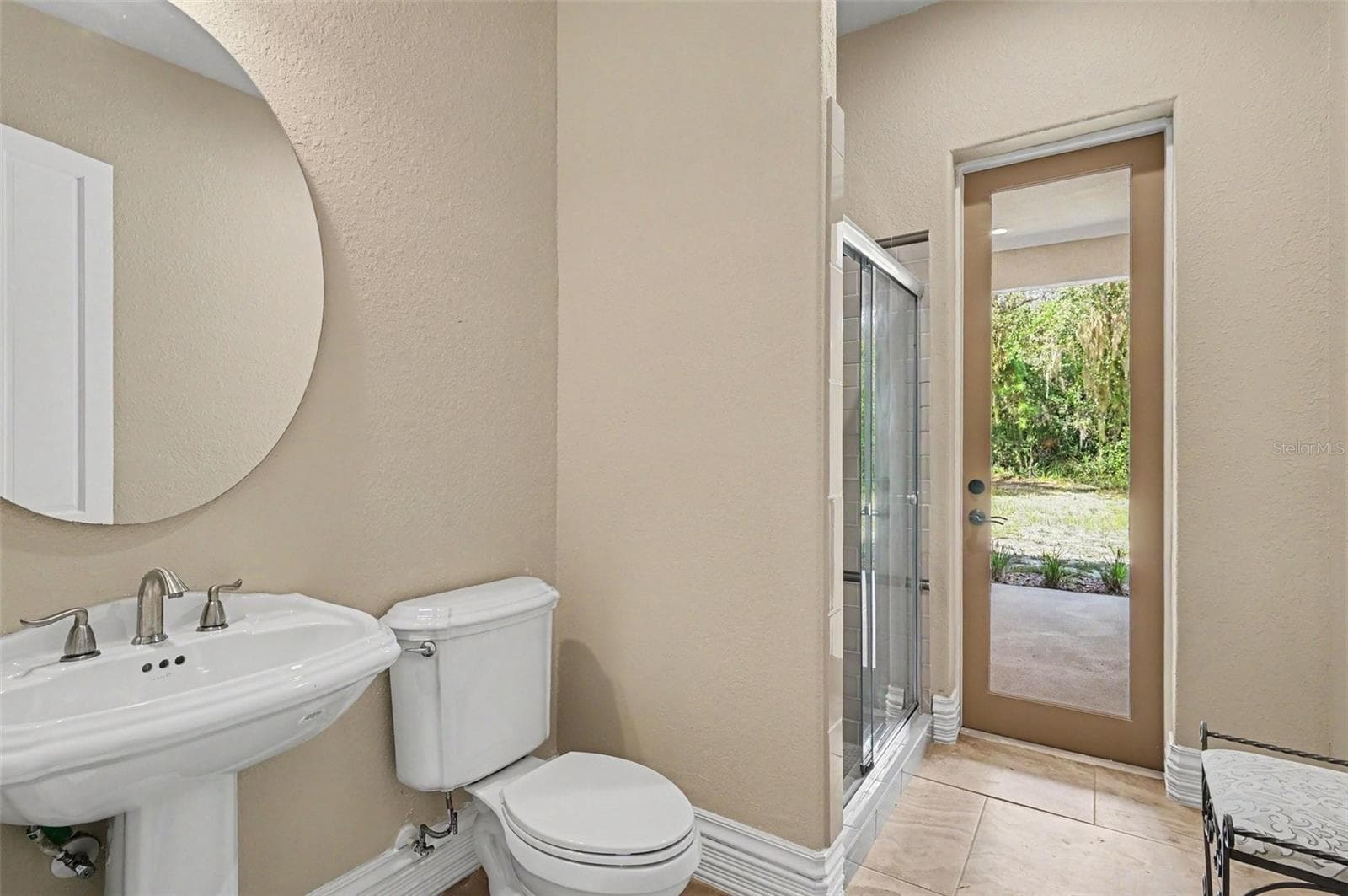 Guest bathroom leading to patio - 2051 LORENE LN, DELTONA
