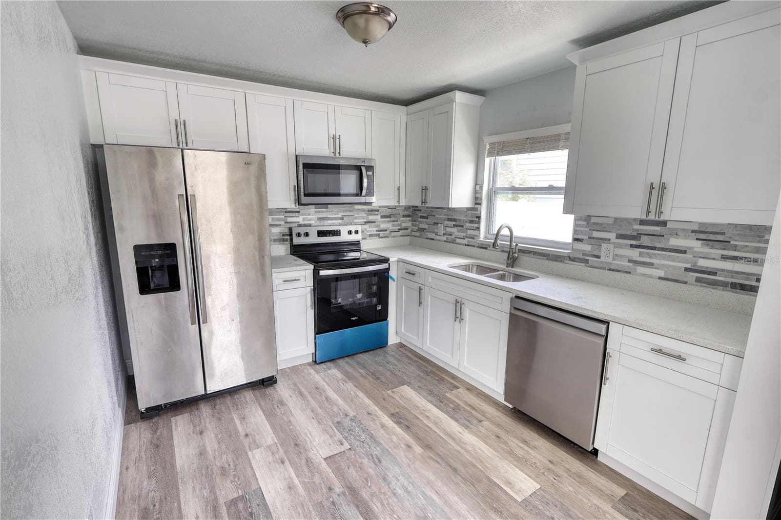 Fully Upgraded kitchens, white shaker cabinets, stainless steel appliances. - 116 44TH ST S, ST PETERSBURG