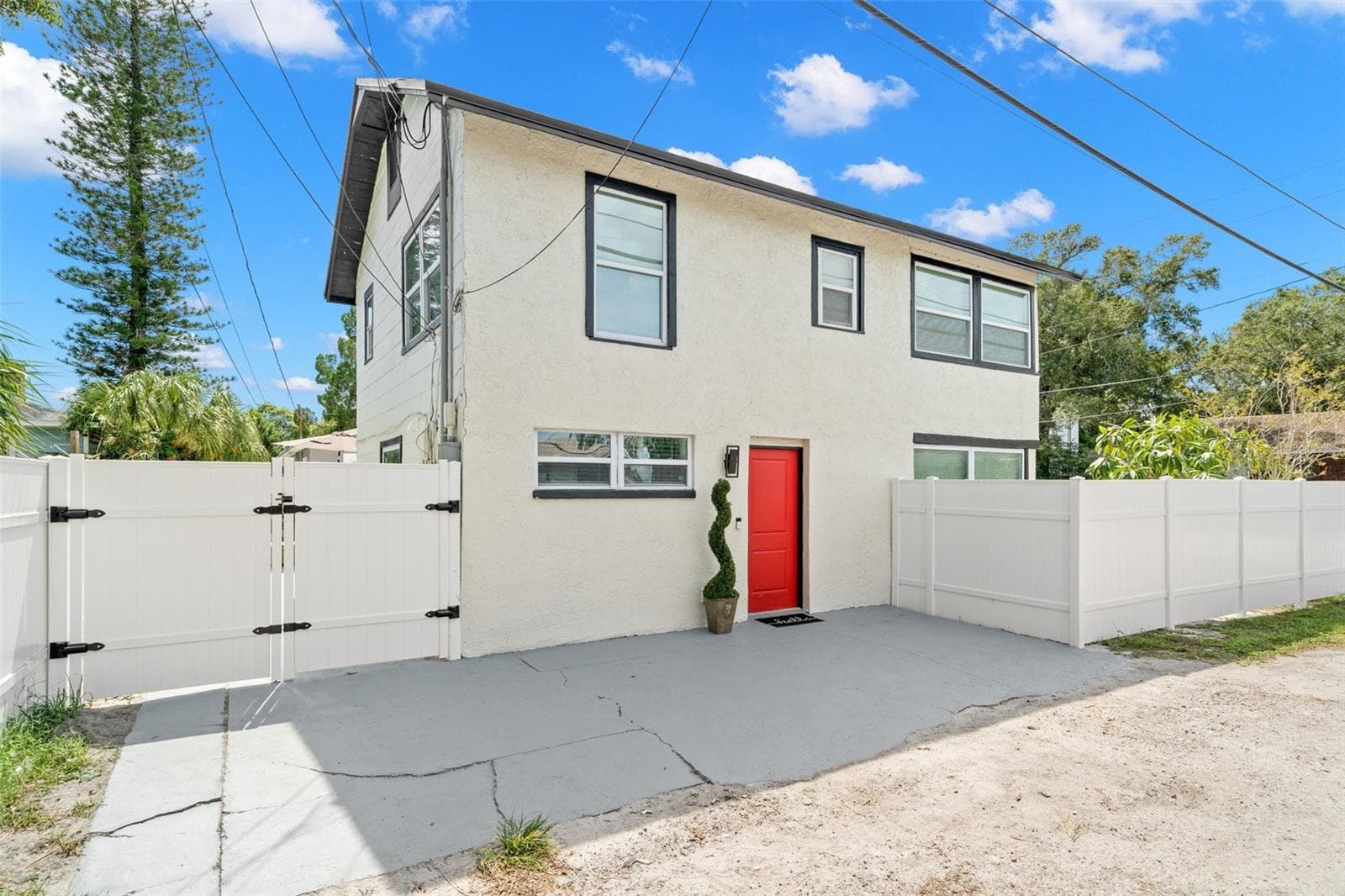 Private entrance to Unit B, a remodeled 1-bedroom residence offering additional rental-income and vinyl privacy fencing. - 116 44TH ST S, ST PETERSBURG
