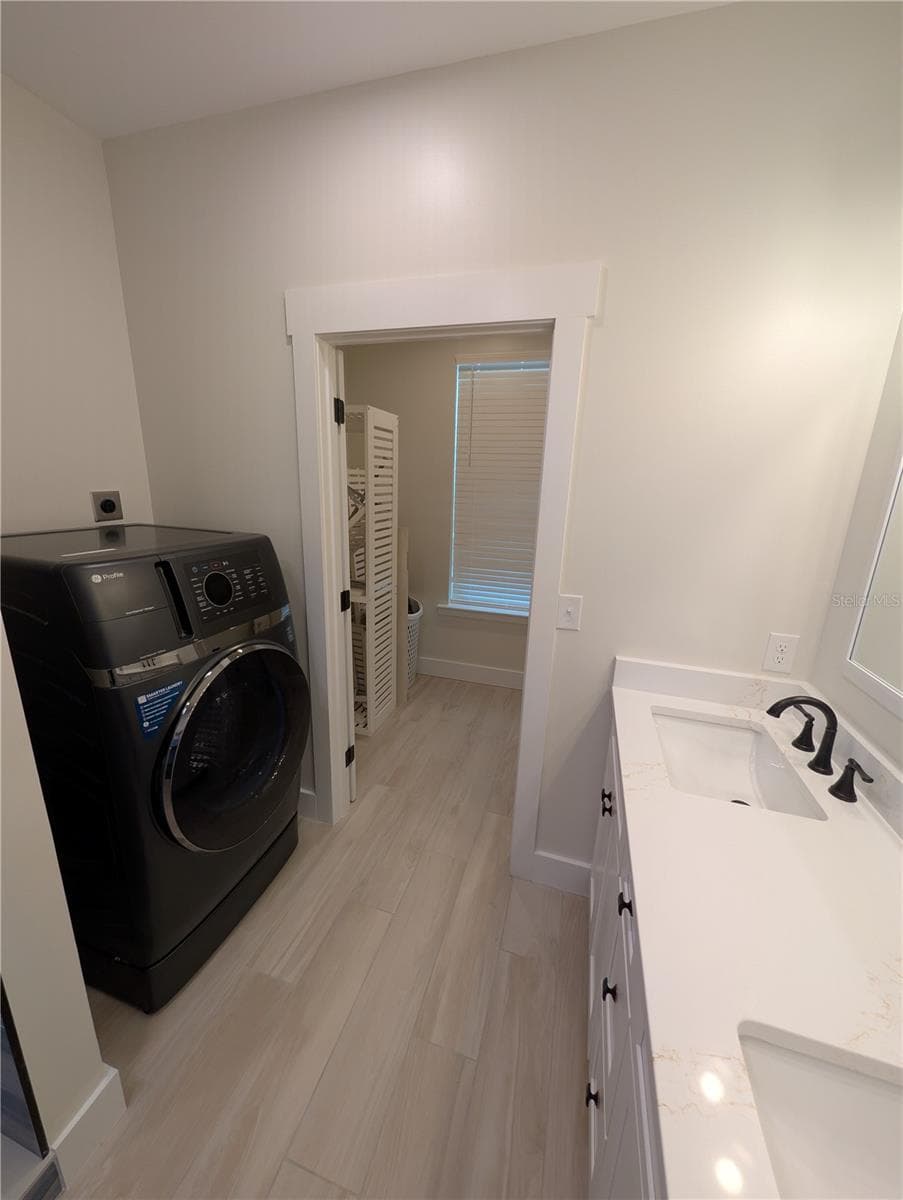 Main House...washing machine/dryer in primary bathroom - 414 JESSAMINE BLVD, DAYTONA BEACH