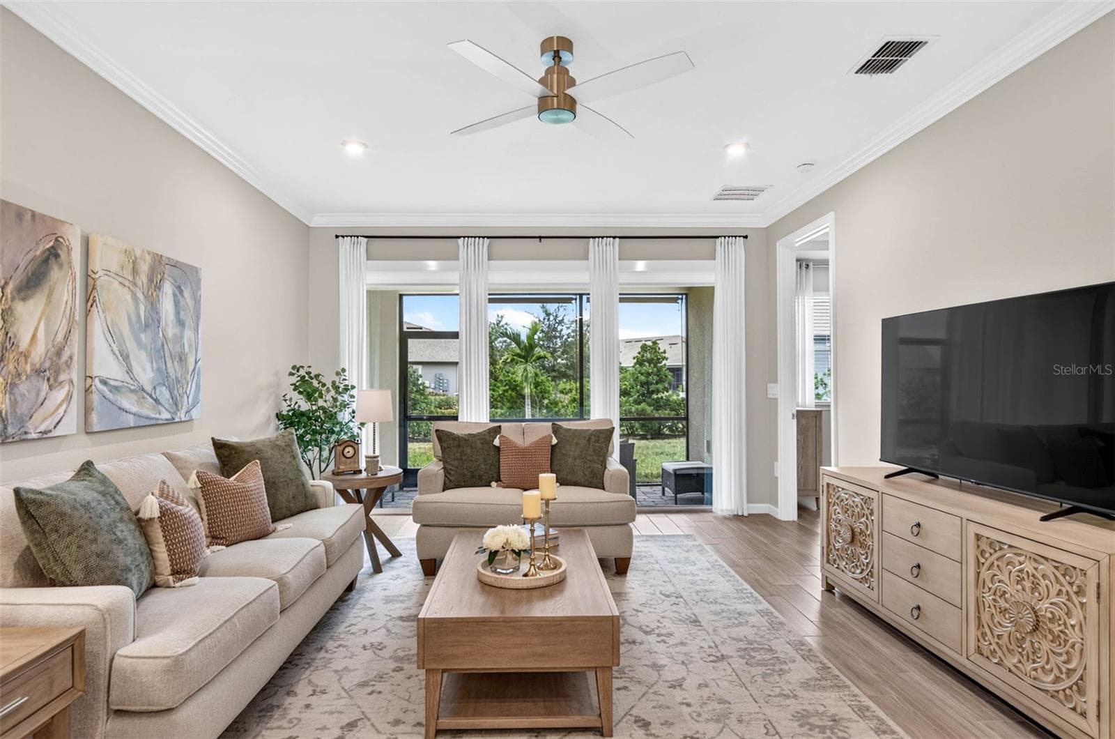 View to back or block with private powered shade - 864 SNAIL KITE PL, SUN CITY CENTER